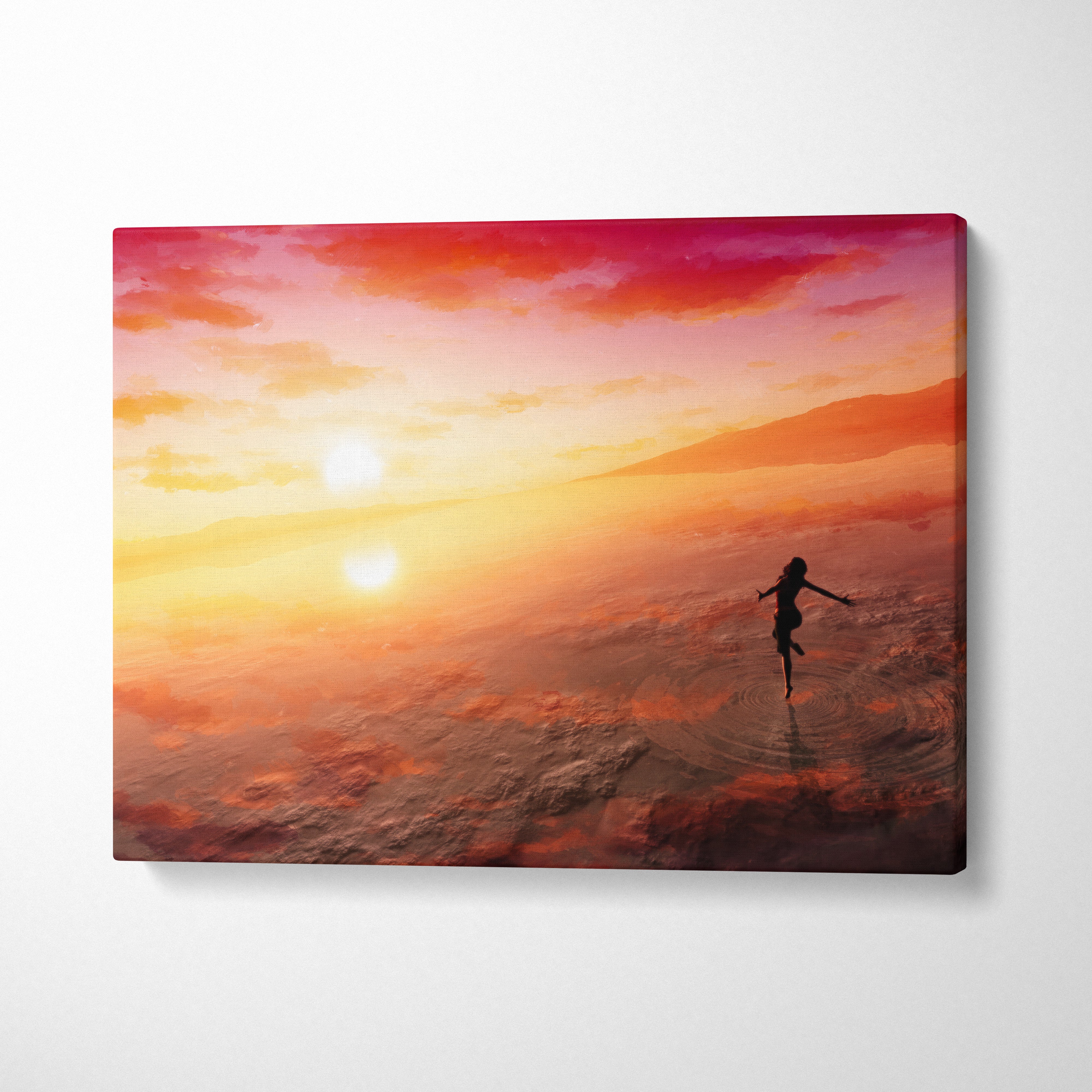 Fiery sunset dancer canvas wall art print with silhouette jumping against vibrant orange red sunset sky for boho decor
