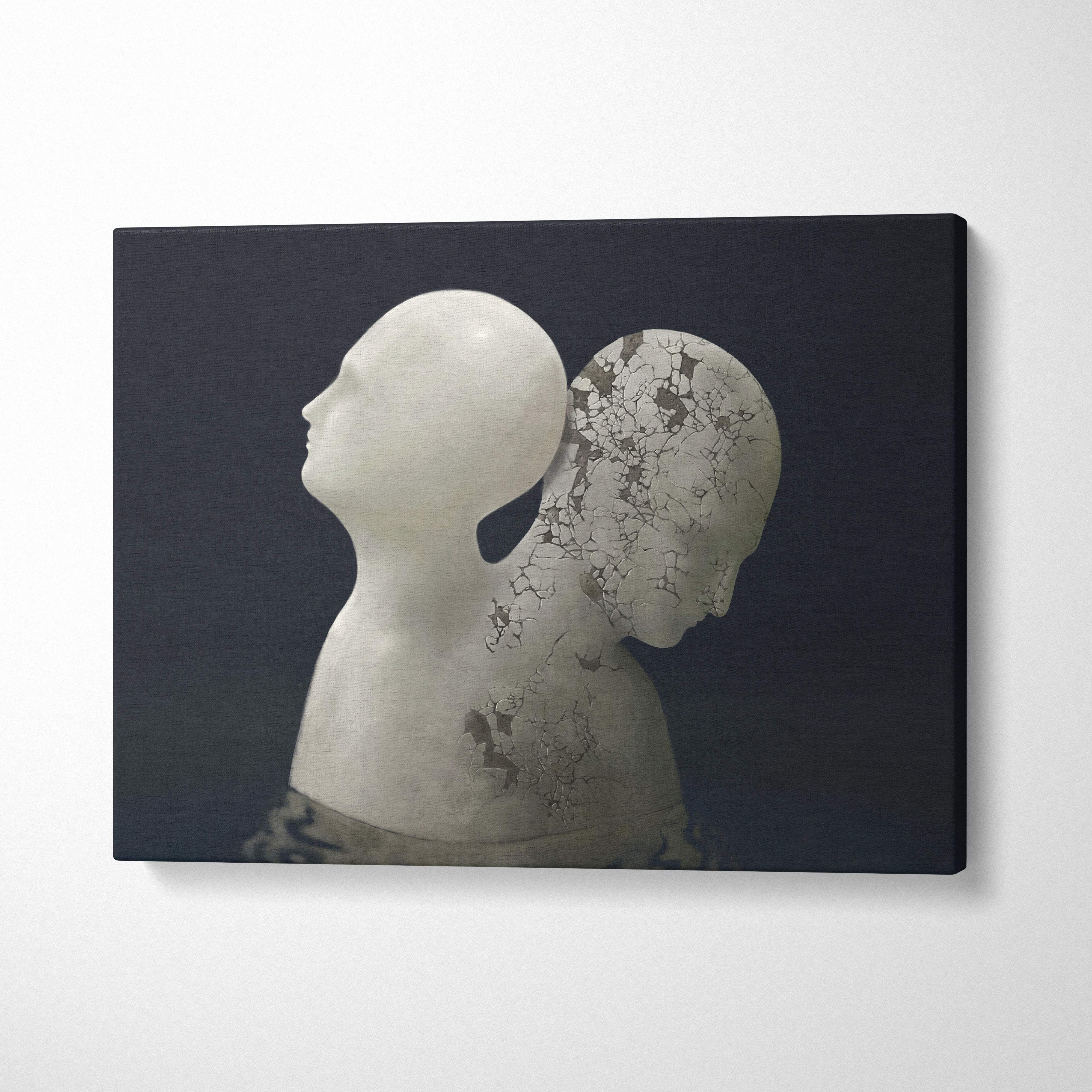 White sculptural canvas print of two stylized human heads one smooth and one cracked revealing dark tones