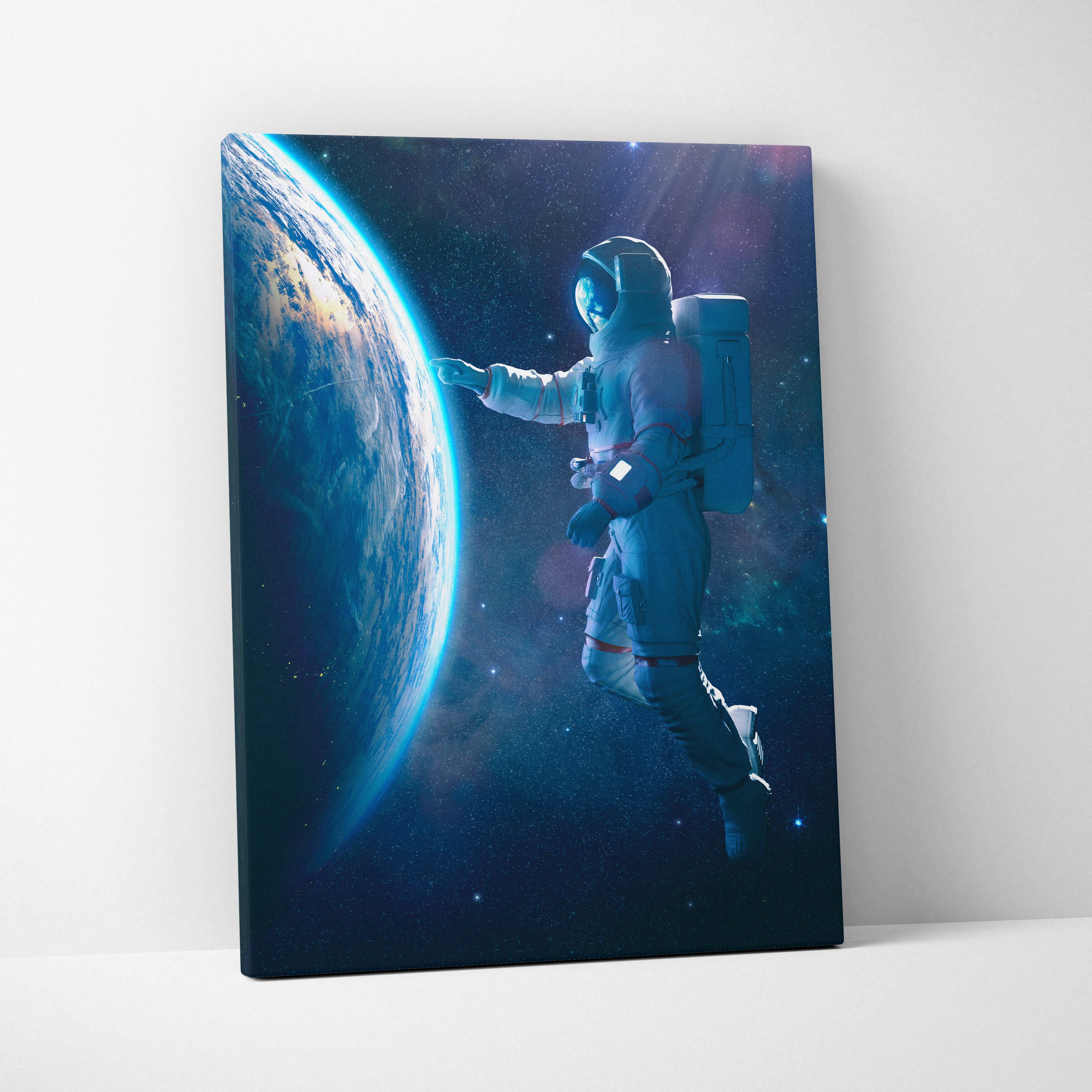 A canvas print of a floating astronaut near earth with blue and brown planet surface in a starry cosmic space scene