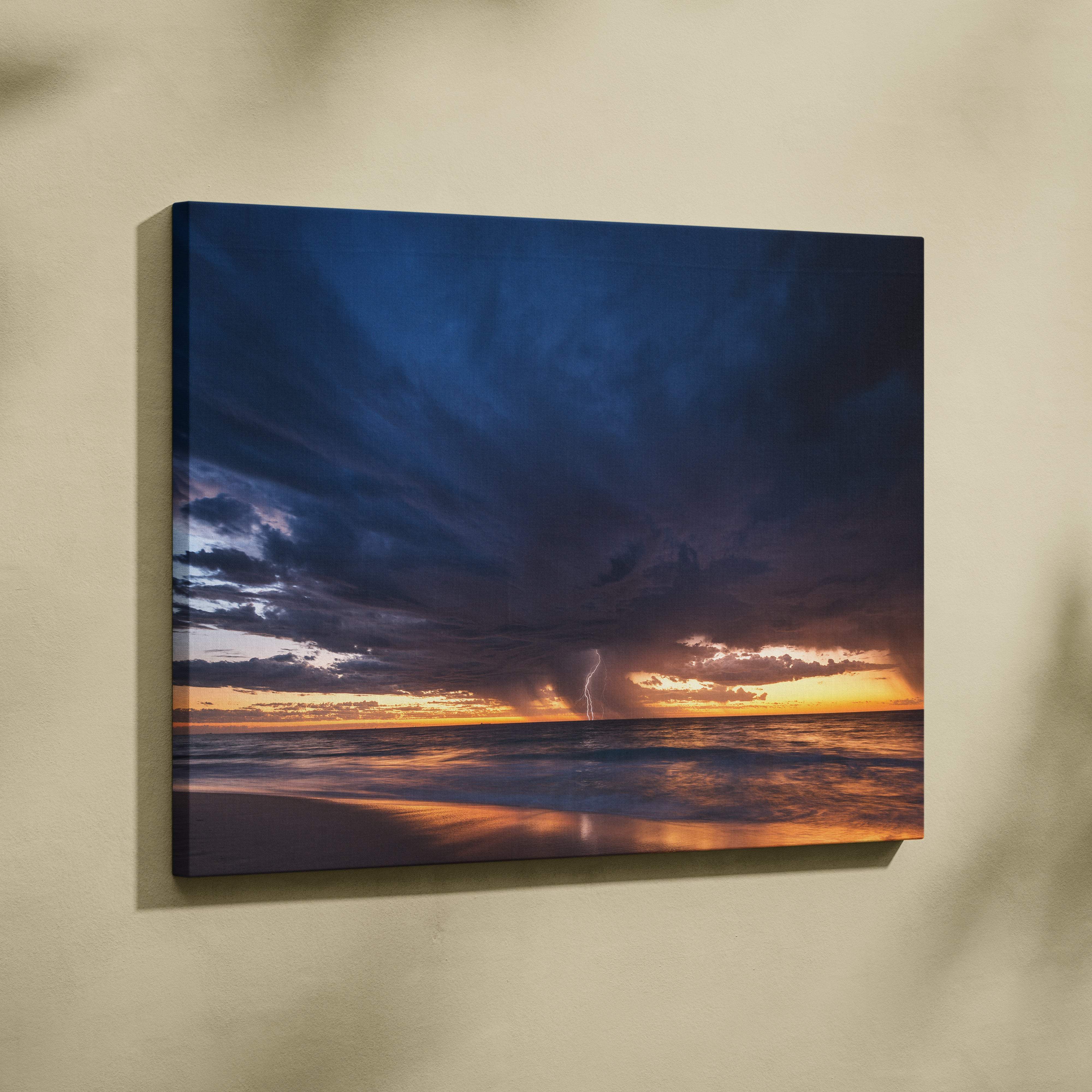 Stormy ocean sunset canvas art with dark blue clouds golden horizon and lightning reflecting on the ocean surface
