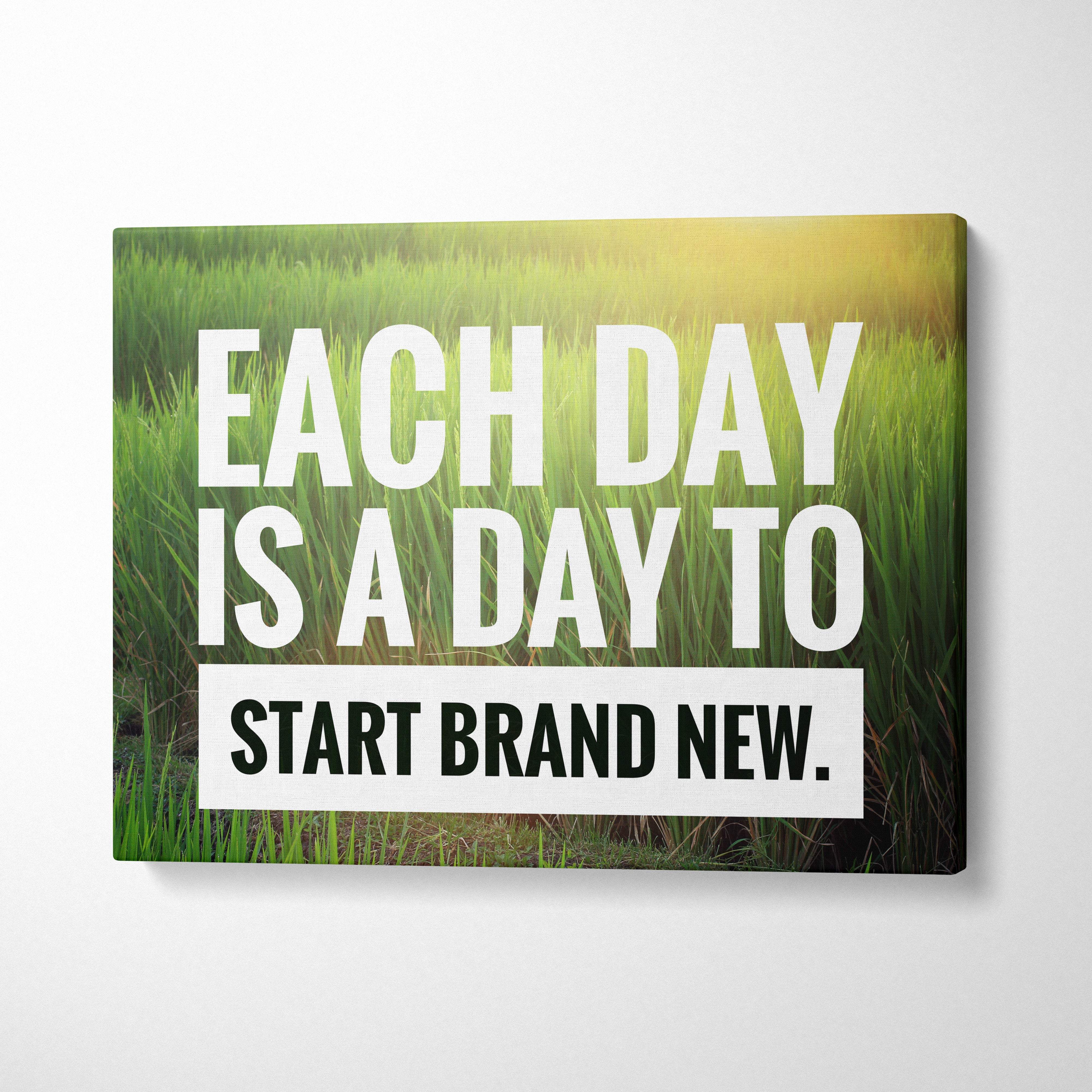 Motivational nature canvas wall art with bold white and black text on green grass and golden sunlight background