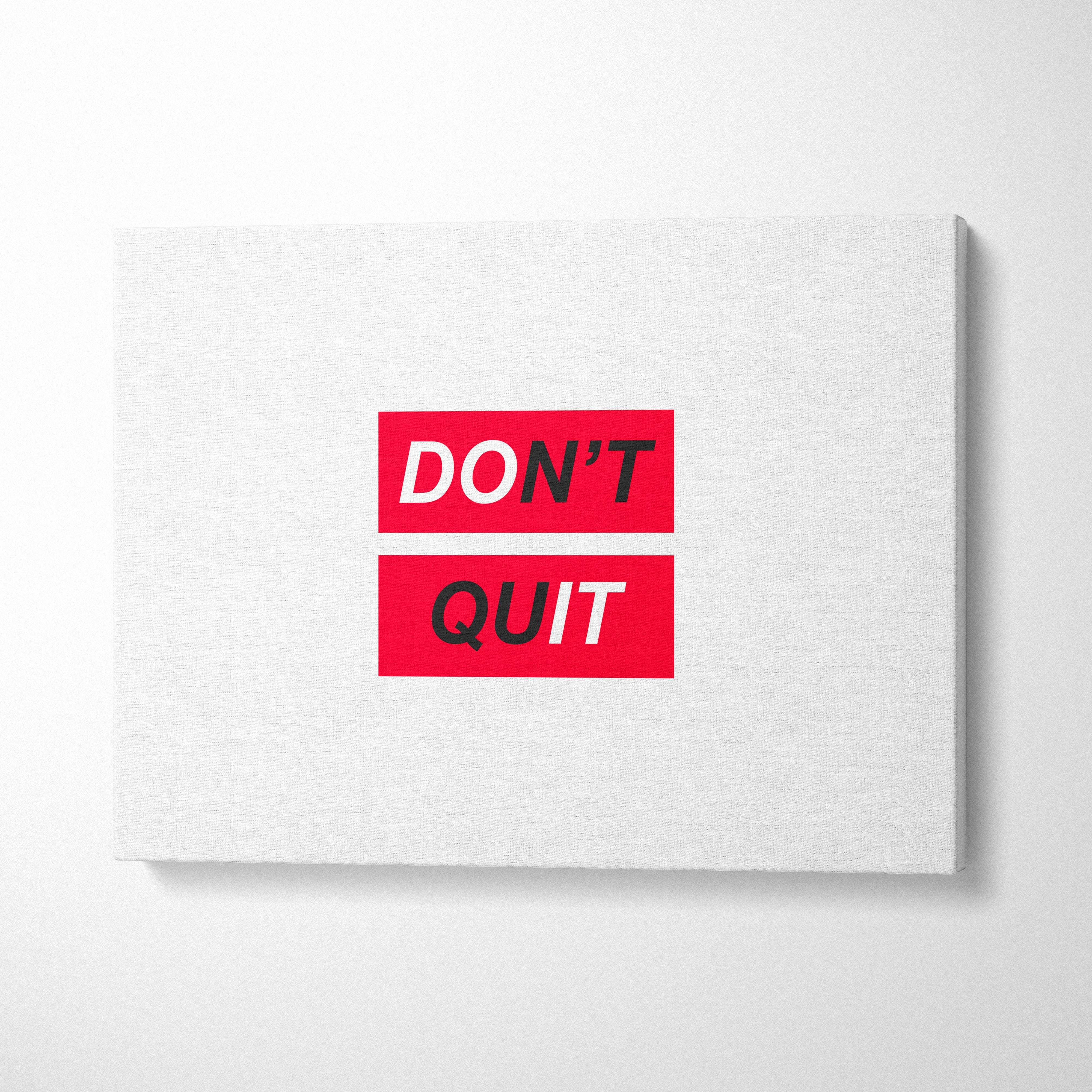 White canvas print with bold red rectangular dont quit text in black and white minimalist motivational wall art