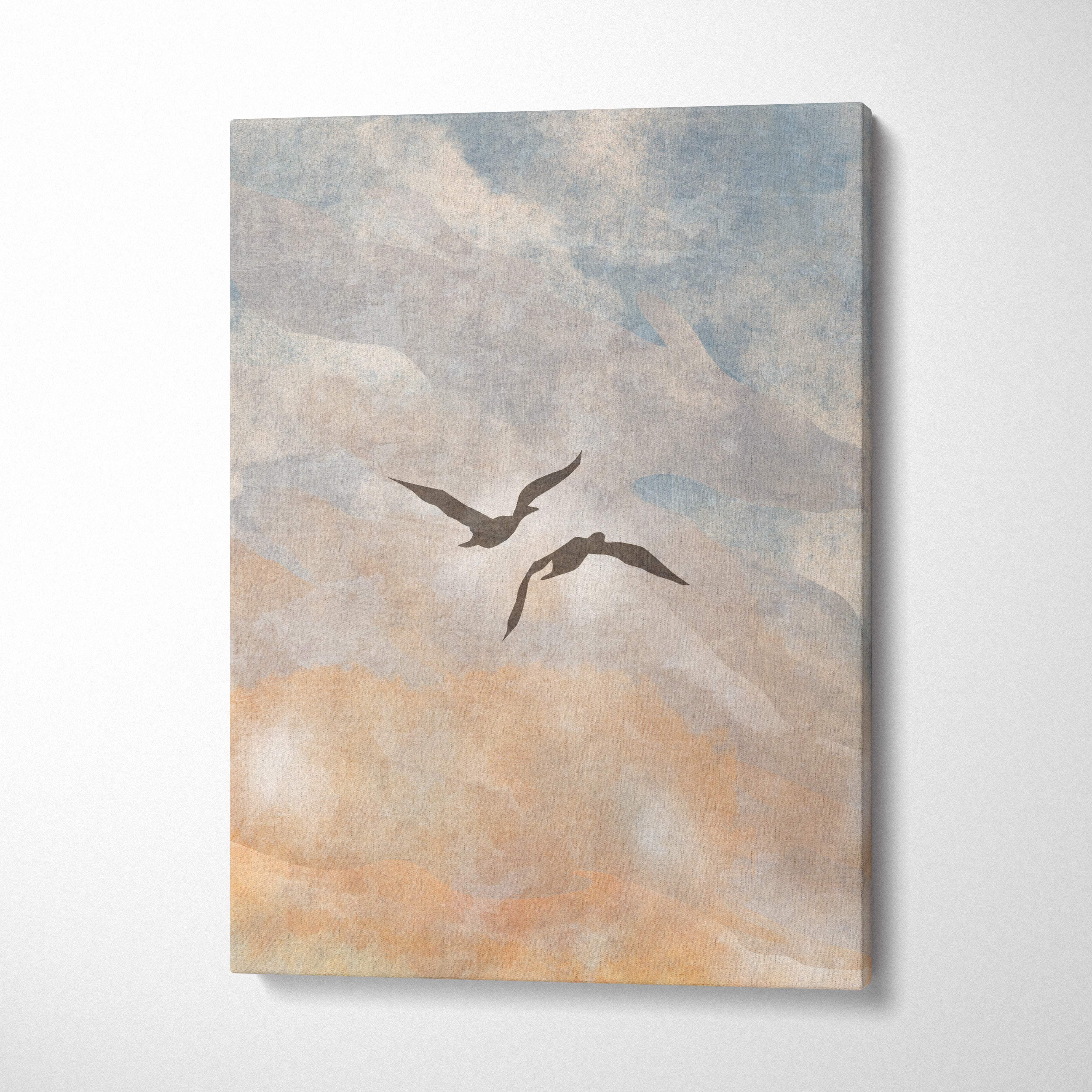 A rectangular boho coastal sky canvas print with two dark silhouetted birds against a soft blue and peach sky