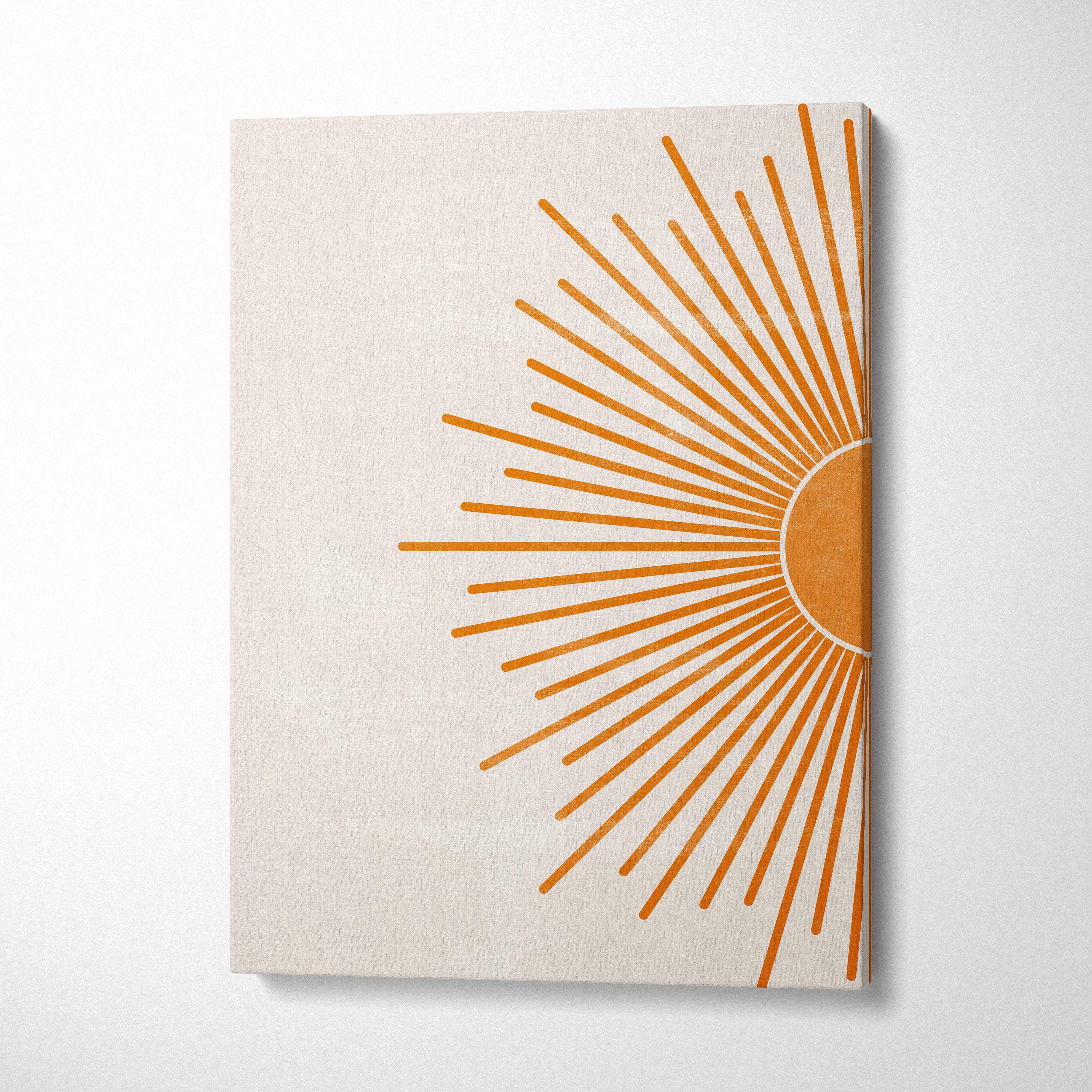 Minimalist sunburst wall art canvas print with stylized orange sunburst on cream background for living room decor