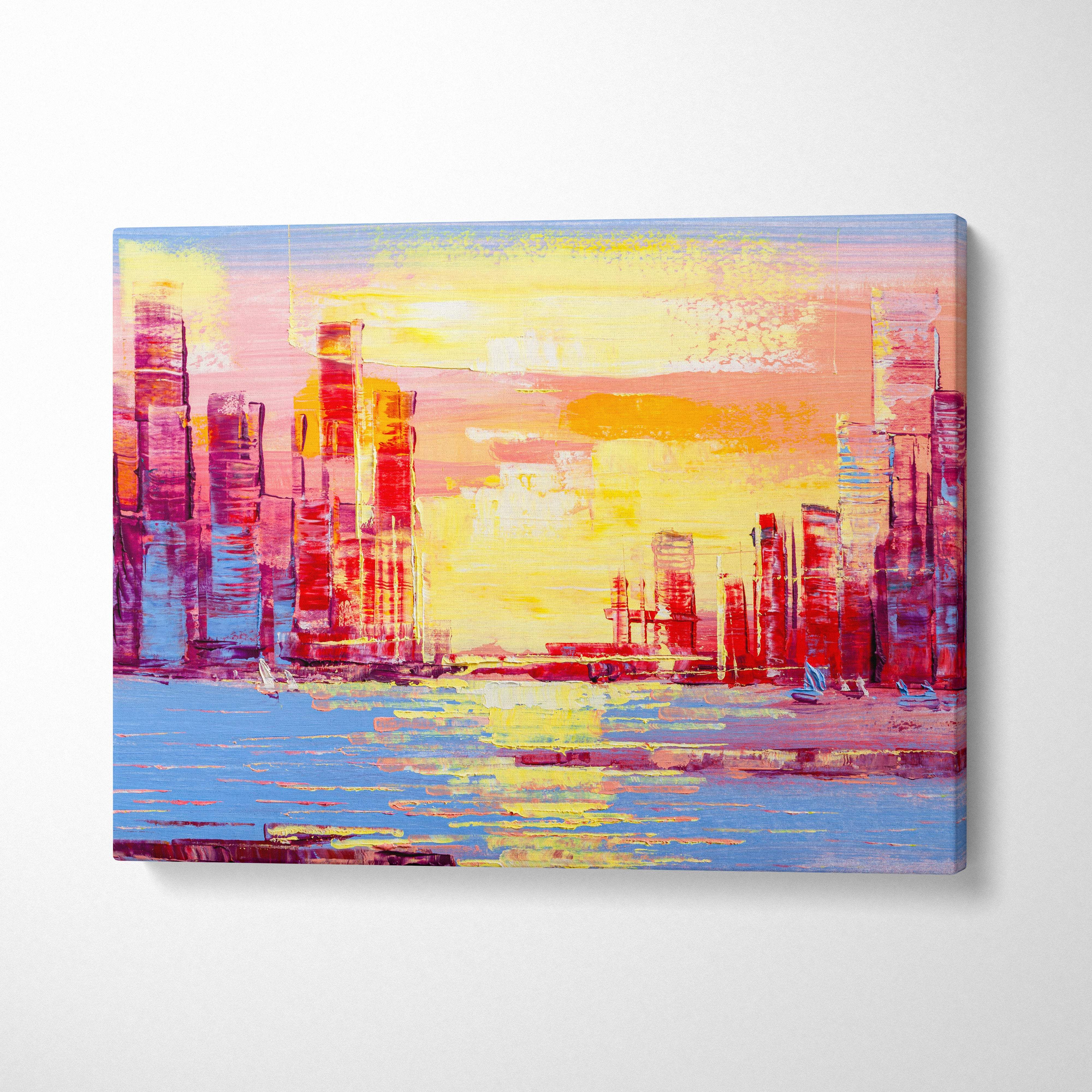 Vibrant city skyline at sunset canvas print featuring bold abstract strokes of yellow orange pink and blue by the waterfront