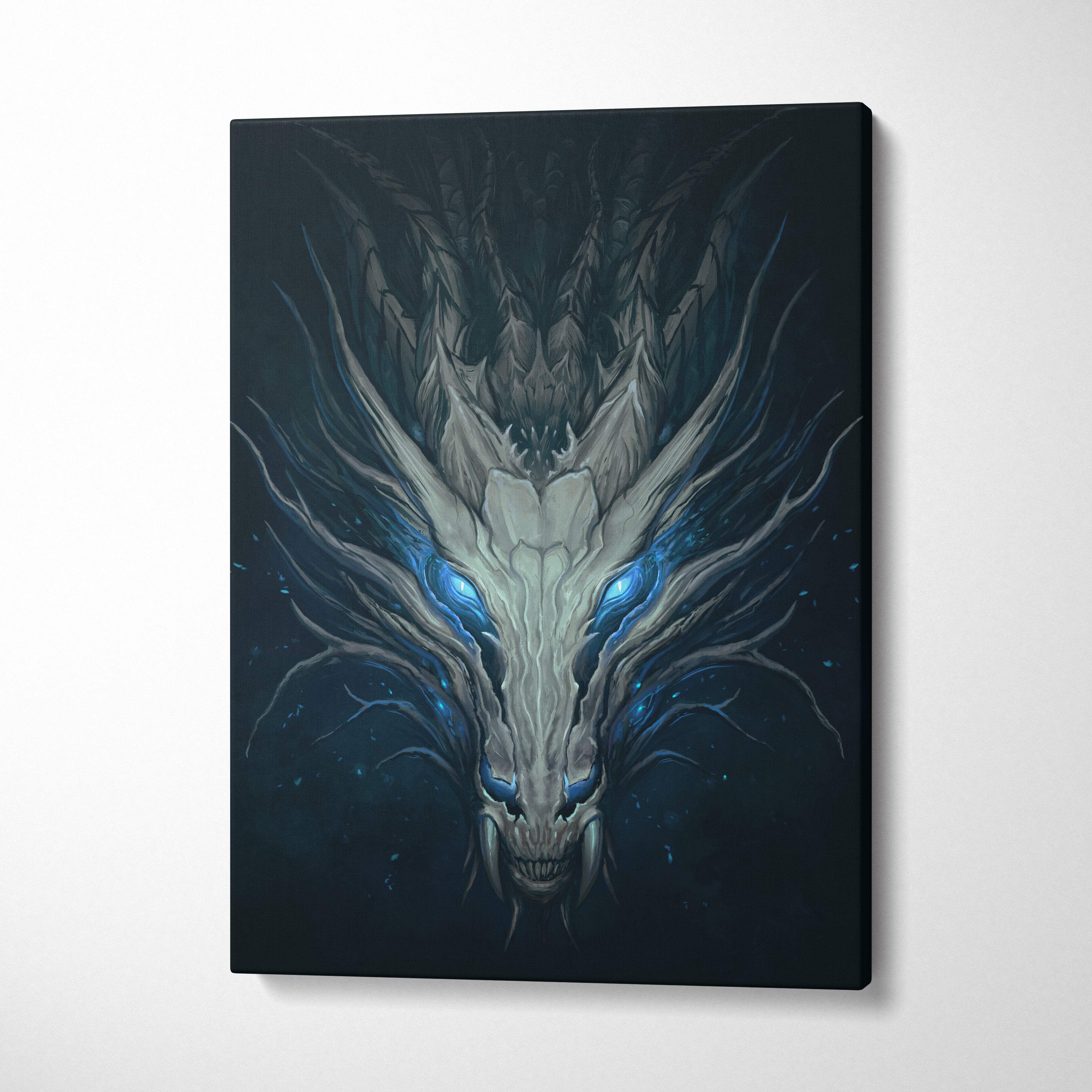 Black canvas print of a symmetrical dragon skull with glowing blue eyes and detailed white and gray scales for gothic wall art