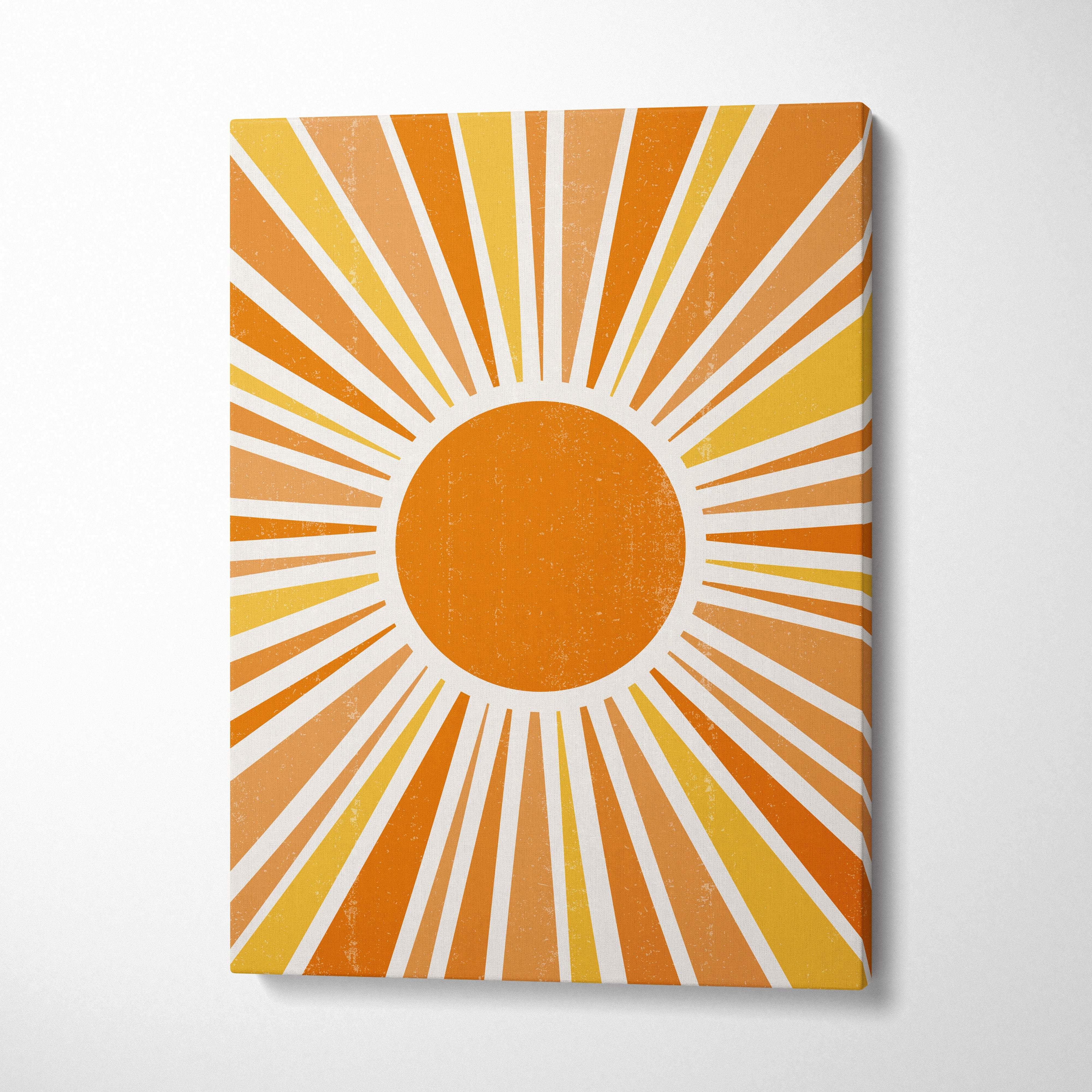 Vintage sunburst wall art featuring vibrant orange and yellow sunburst with white rays on textured canvas print