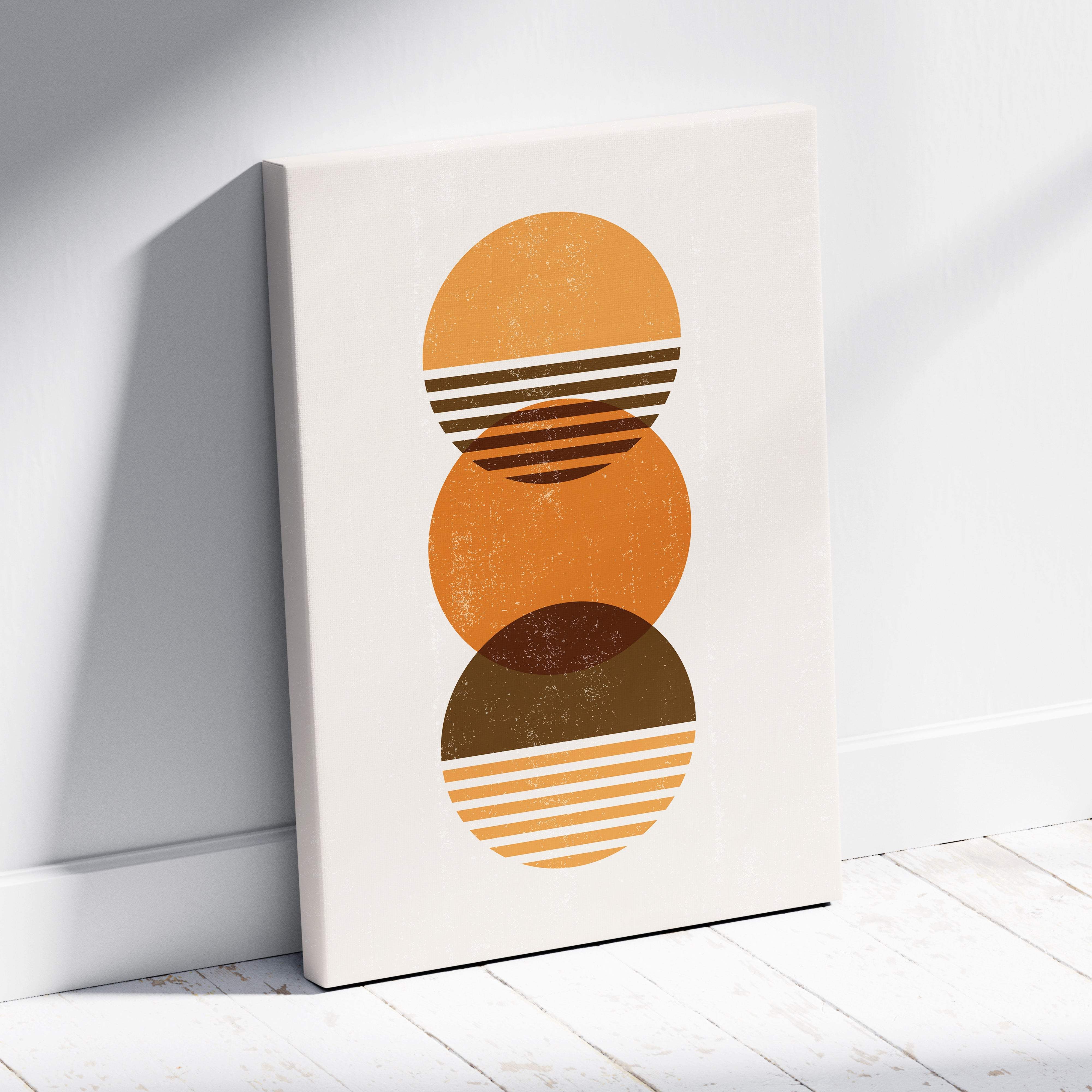 A minimalist canvas print of three stacked orange and brown striped circles in terracotta and ochre tones for boho decor