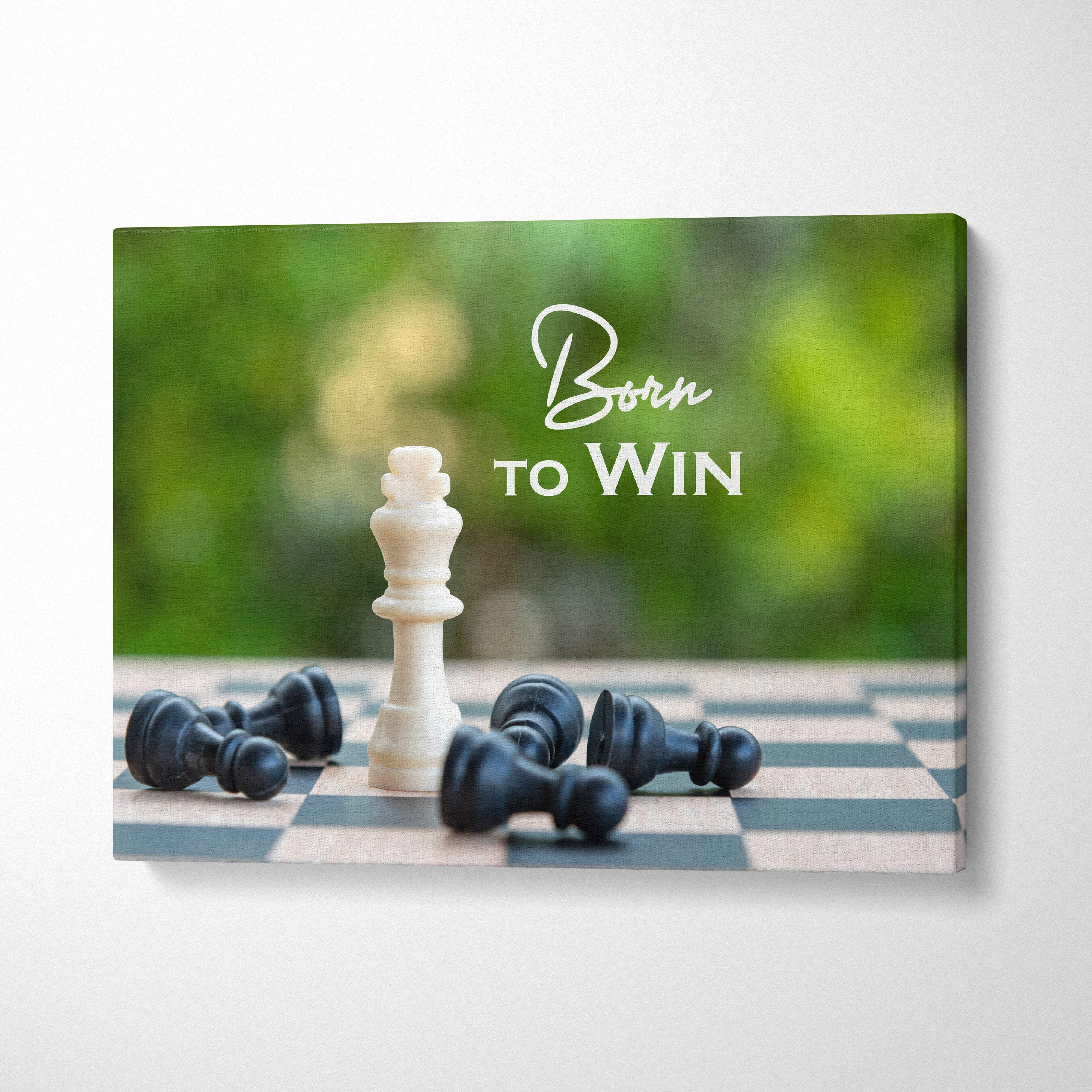 Motivational born to win canvas wall art featuring a white chess king on a board with fallen black pieces and script text