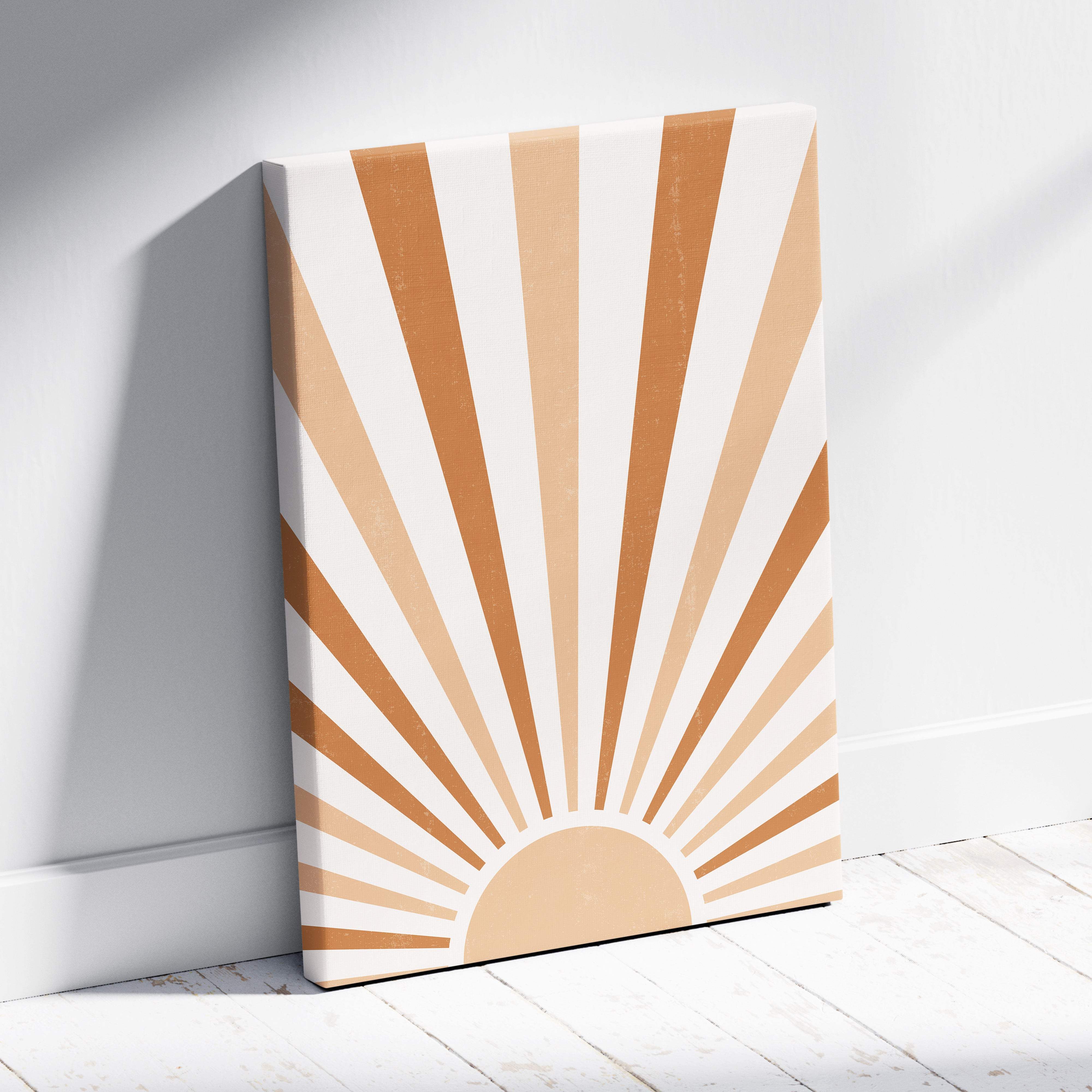 Boho sunrise canvas wall art with beige and cream sunburst stripes on canvas leaning against white wall