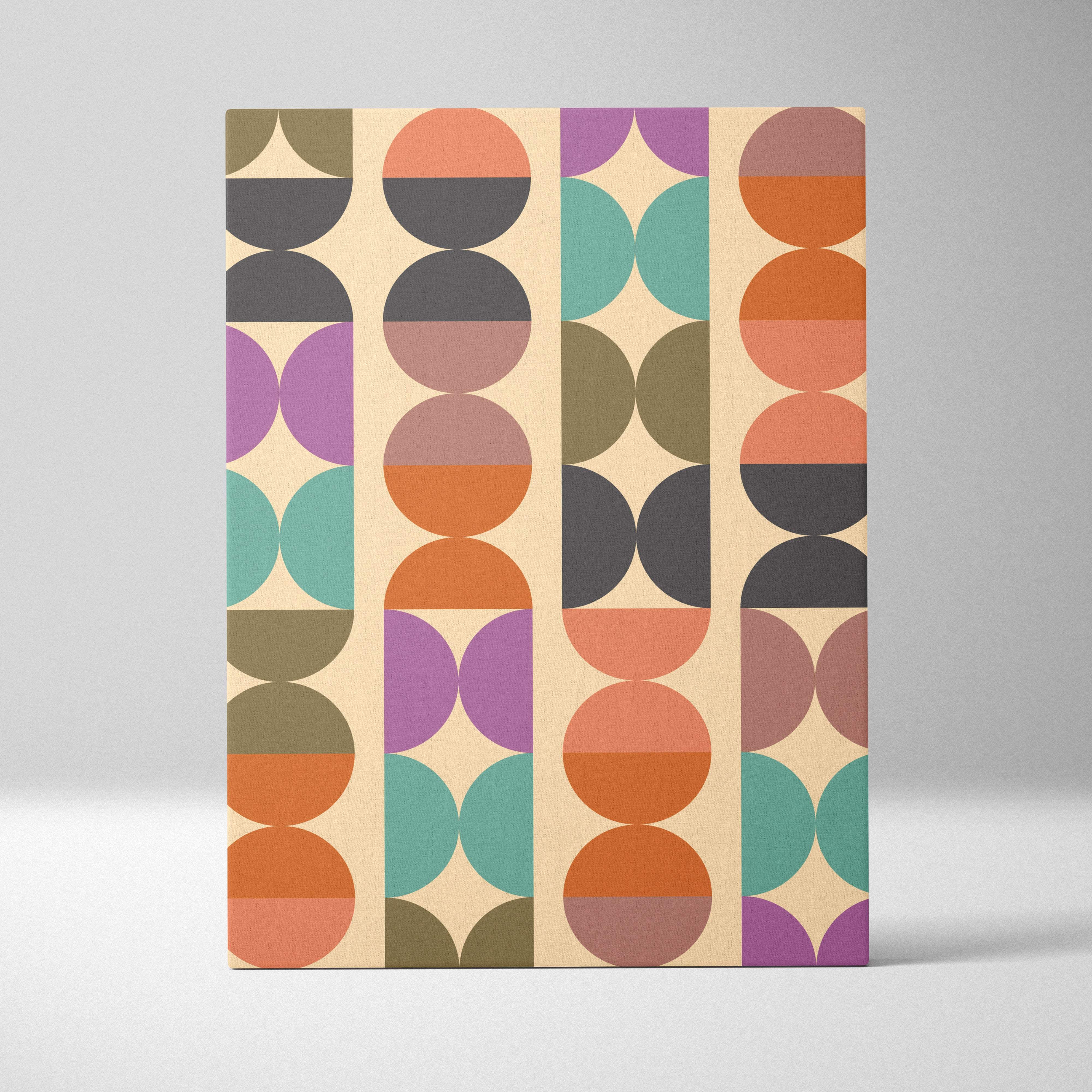 A rectangular beige canvas wall art with vertical columns of retro abstract circles and arches in earth tones