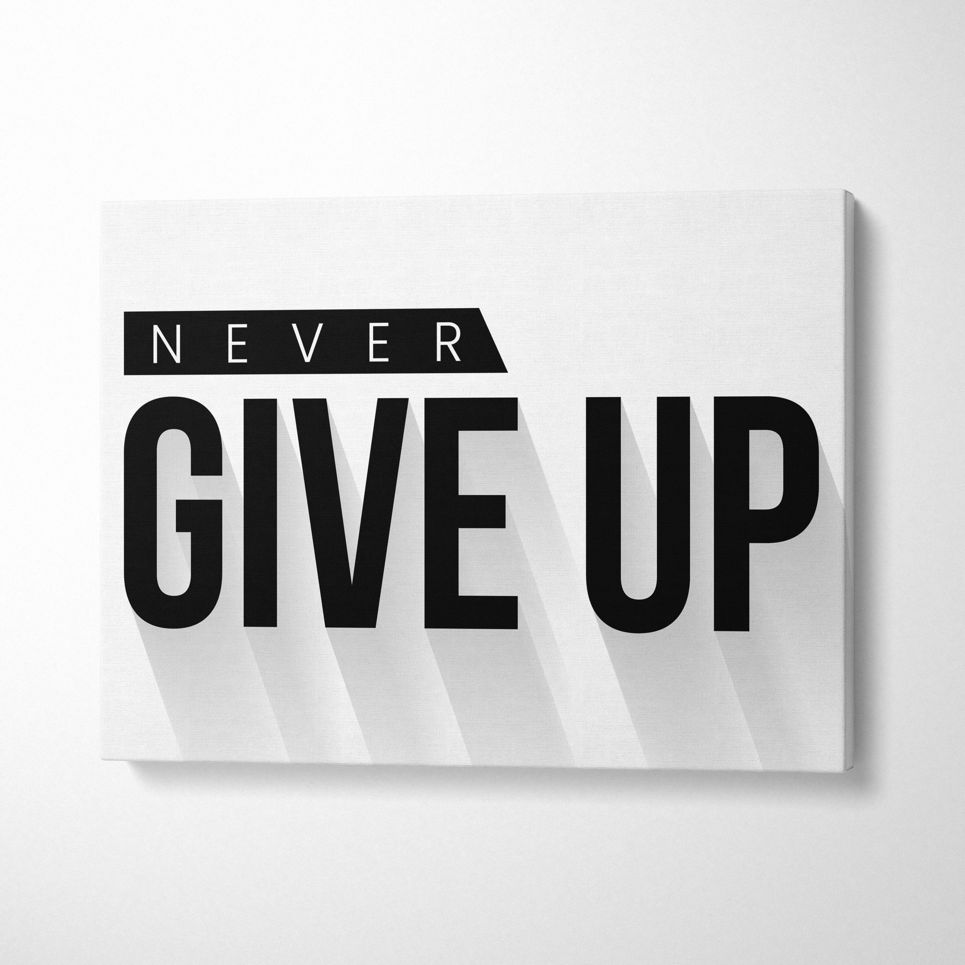 White canvas wall art with bold black never give up text in modern font for office gym or home decor motivational print