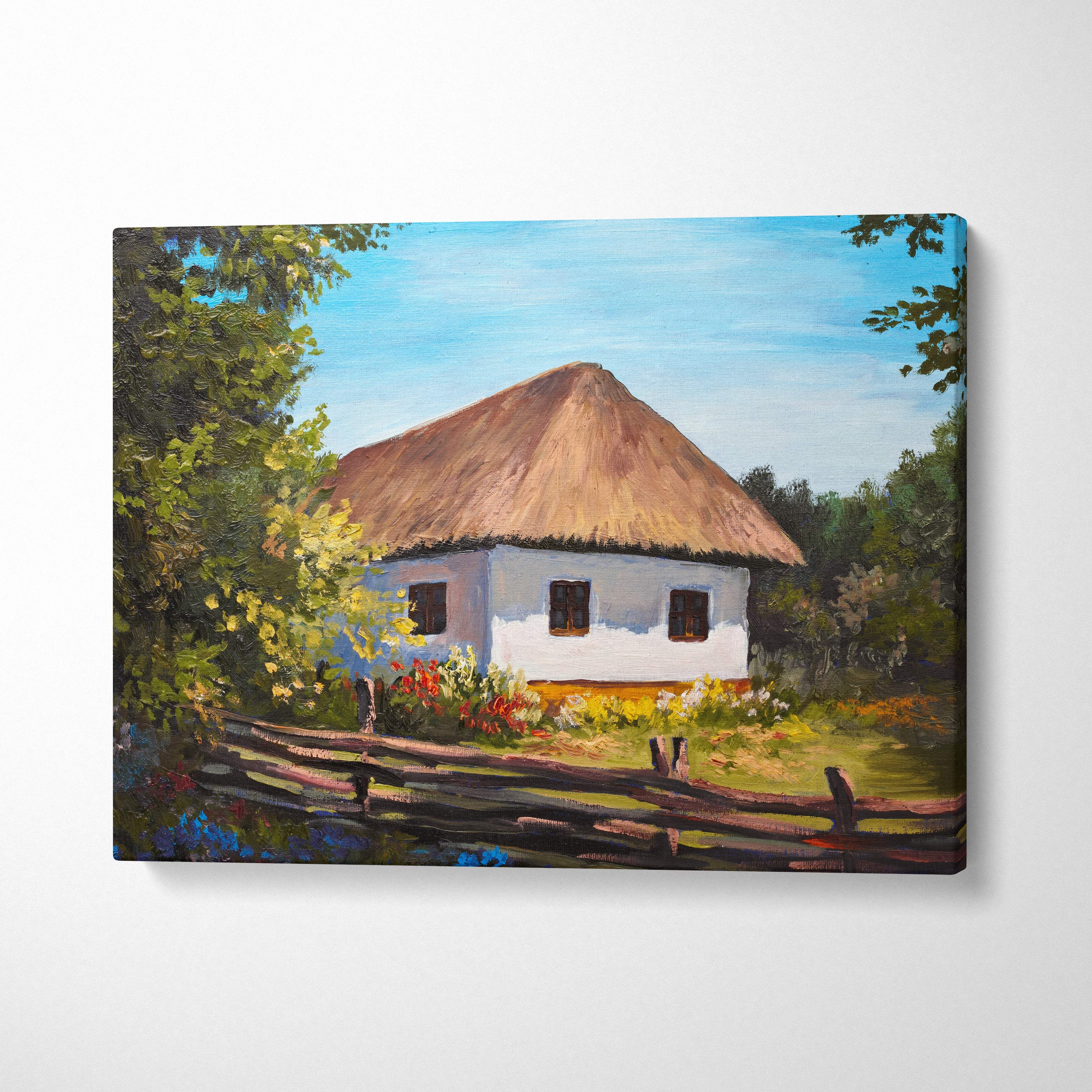 Rustic white cottage canvas wall art print featuring a farmhouse with a thatched roof surrounded by greenery and flowers
