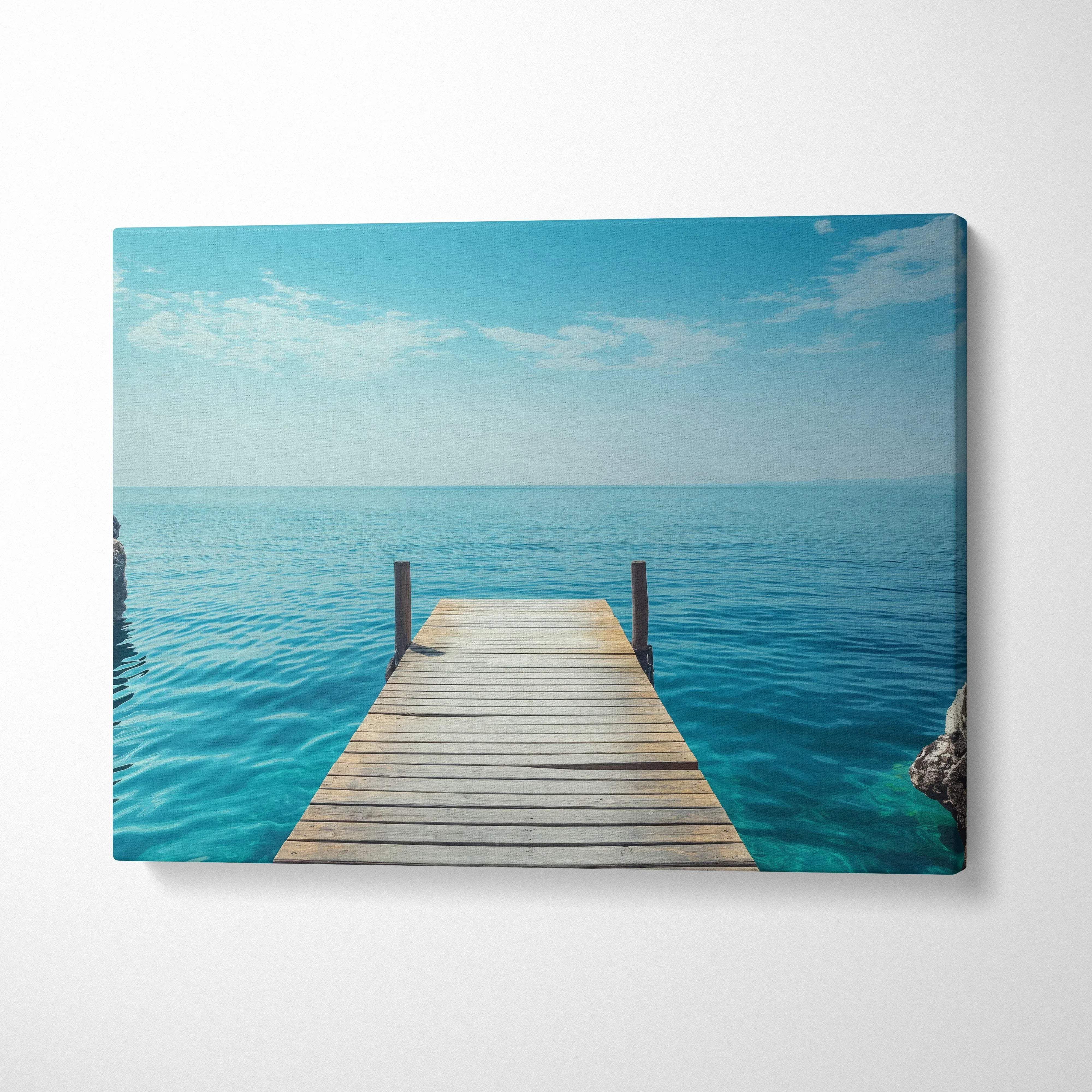 Canvas print of wooden pier over turquoise ocean under blue sky