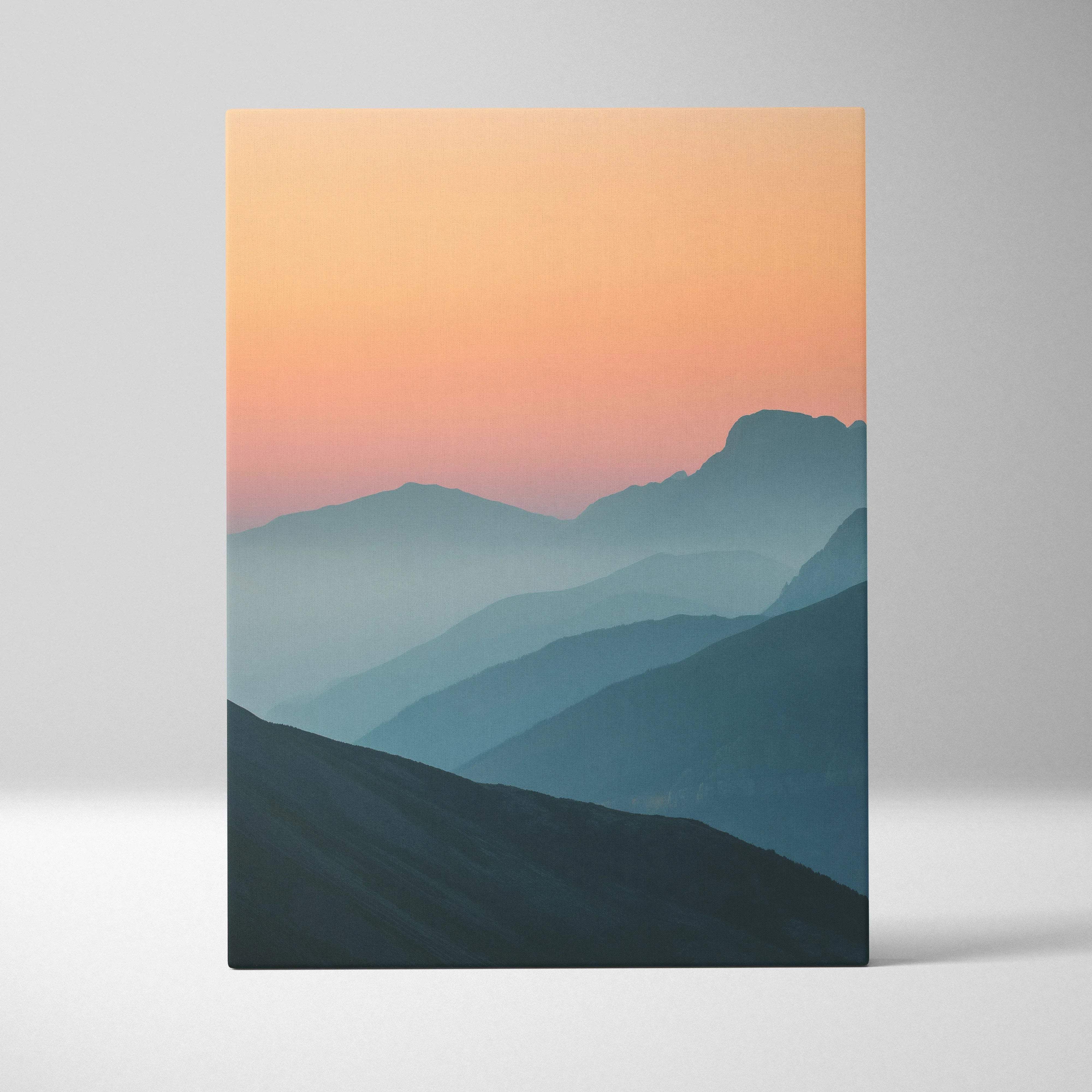 Canvas wall art: minimal mountain sunset peaks over layered blues peach sky