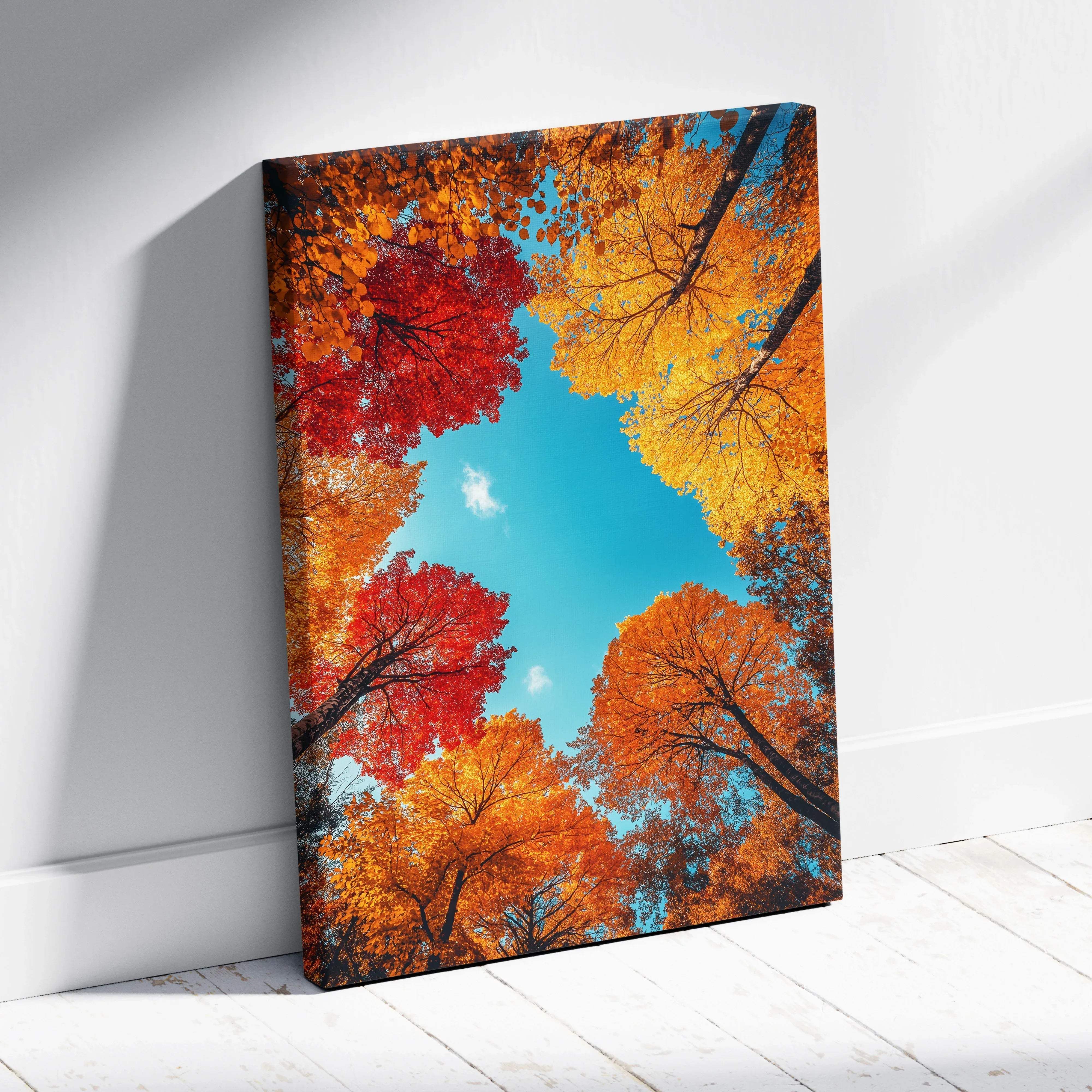 Autumn forest canopy canvas wall art featuring vibrant red and golden orange foliage against a bright blue sky