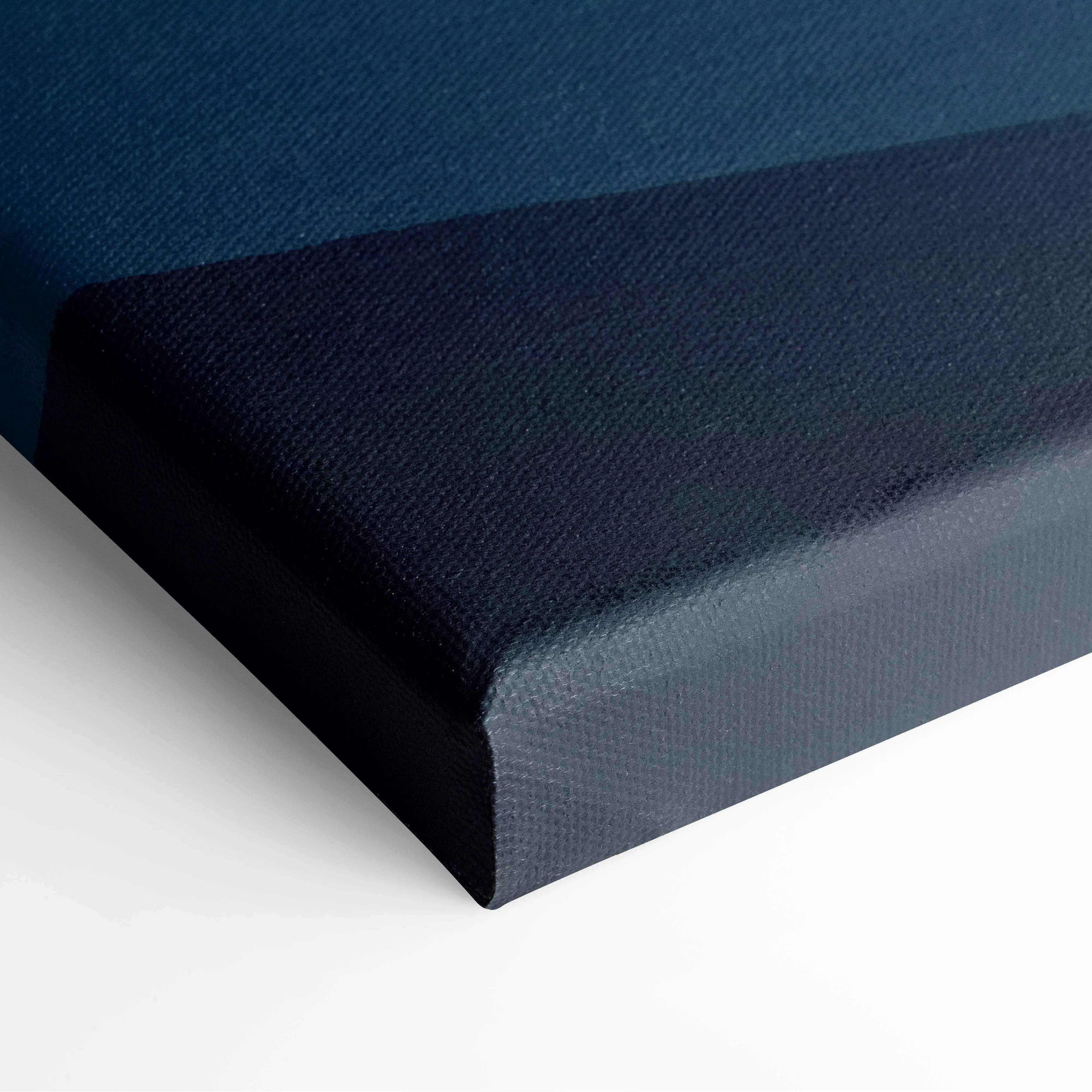 Dark blue gradient sunrise over mountains canvas print in black frame