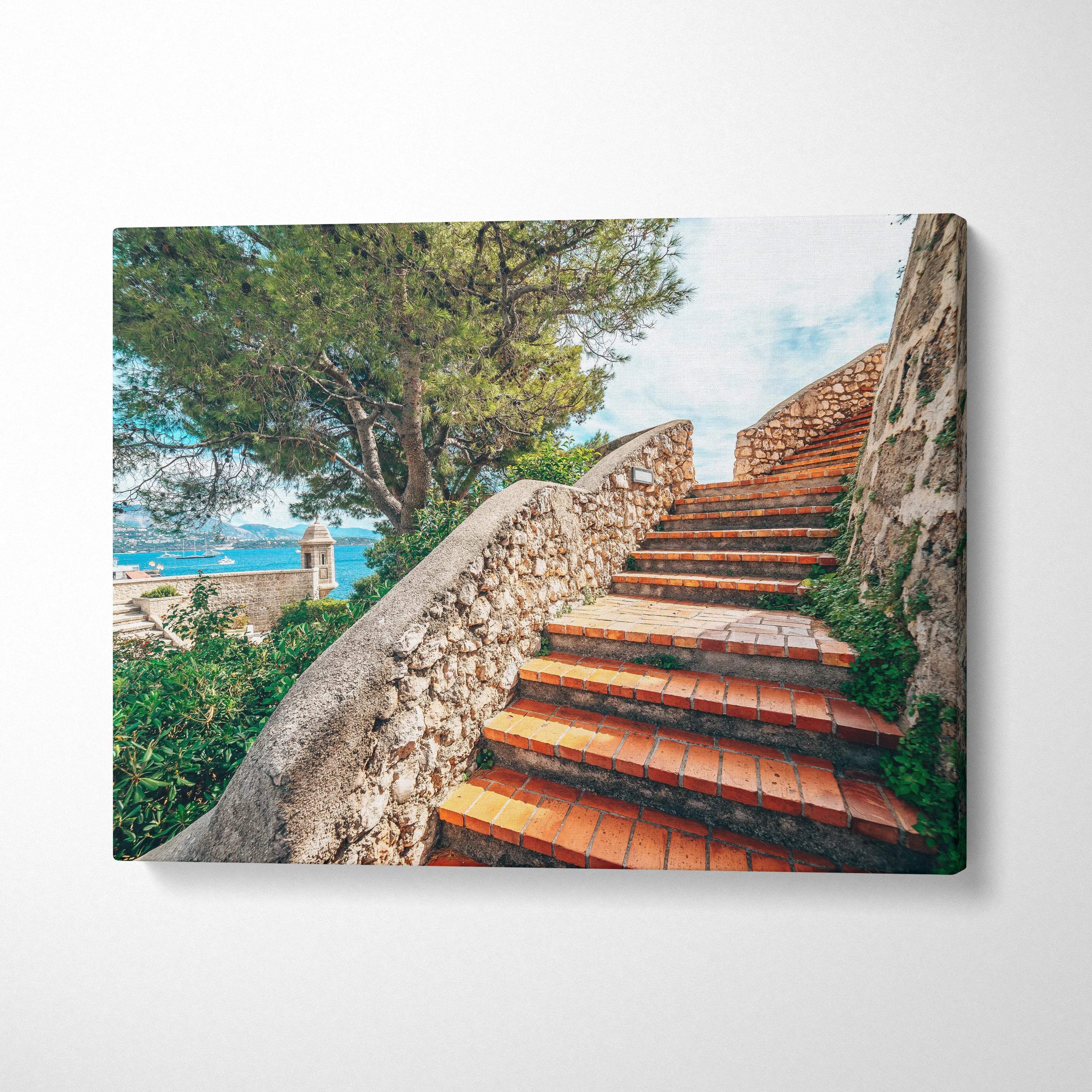 Canvas wall art featuring terracotta stone stairs with rustic railings and lush tree foliage in background.