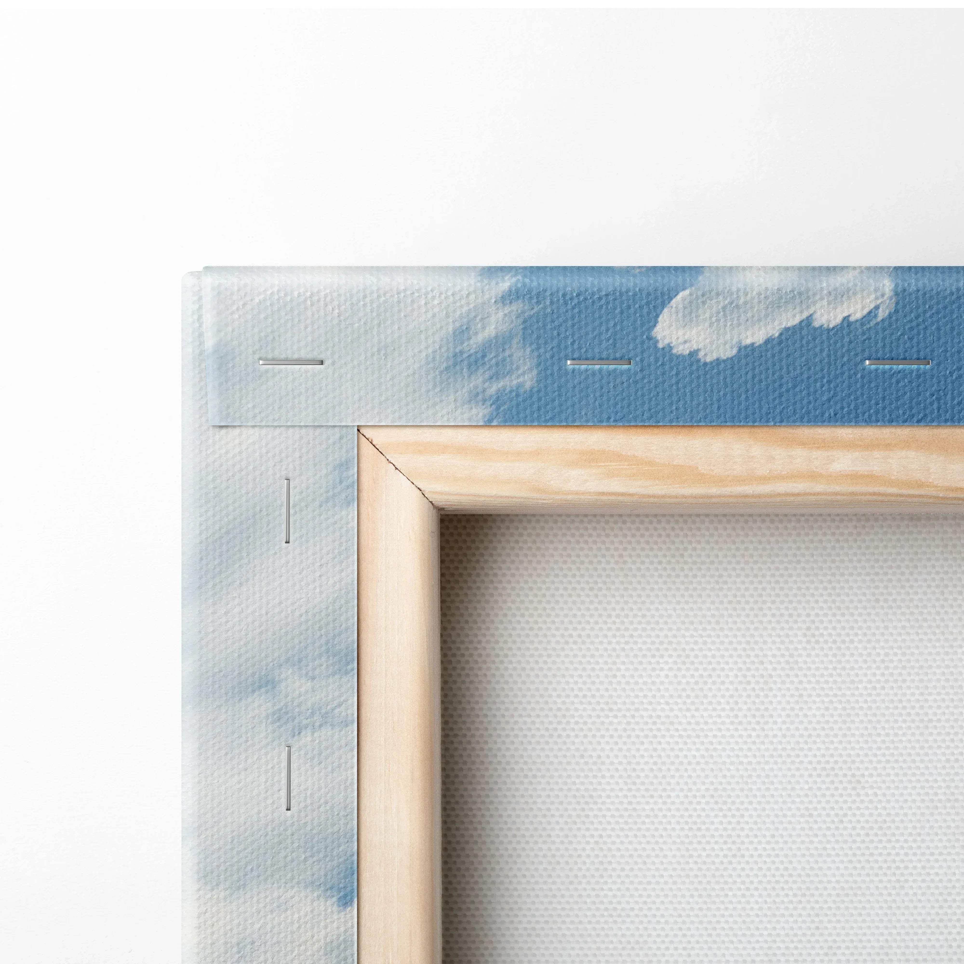 Light wood-framed canvas print featuring a soft blue sky with white clouds in floral mountain landscape meadow design