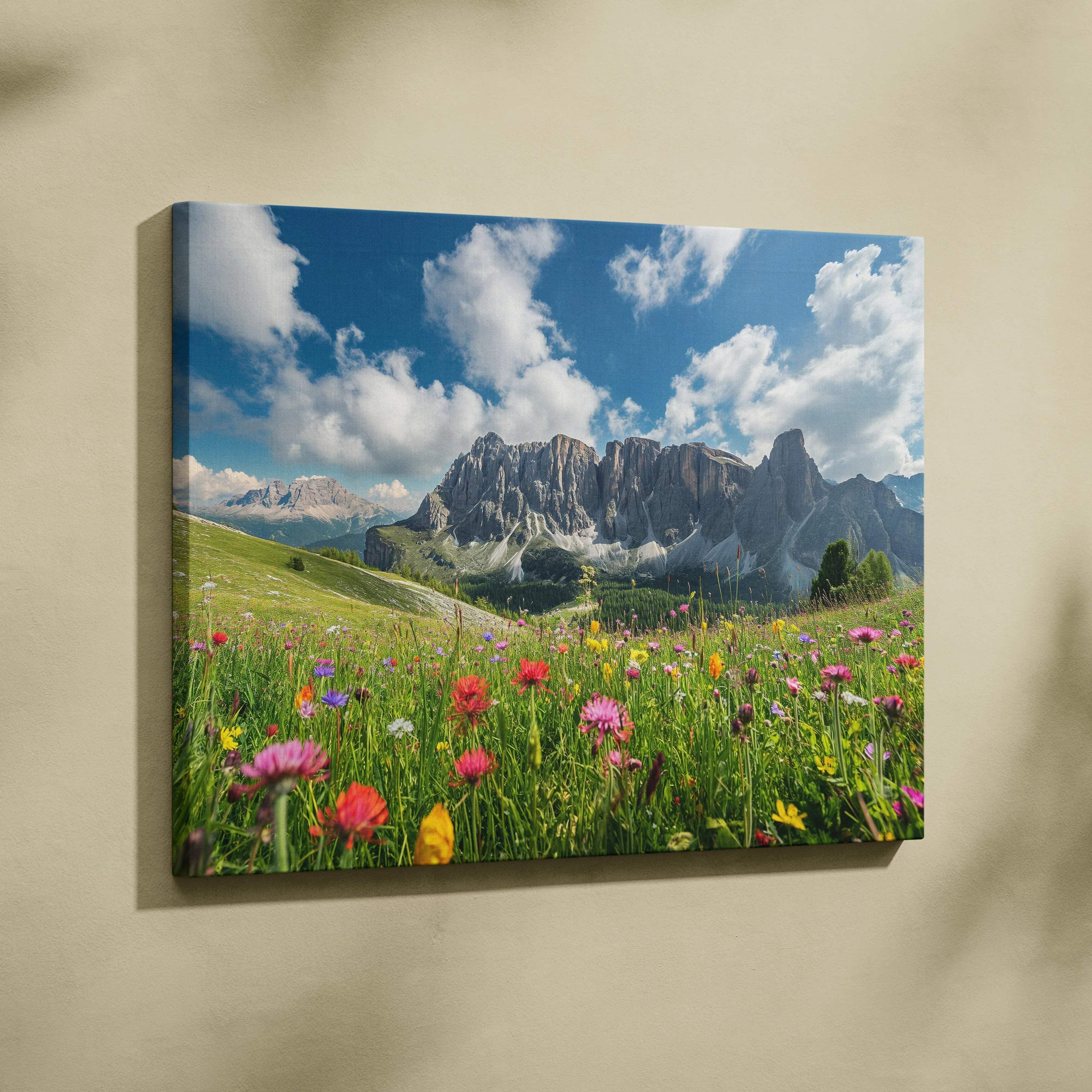 A vibrant canvas wall art depicting a colorful wildflower meadow and mountainous landscape under a clear blue sky