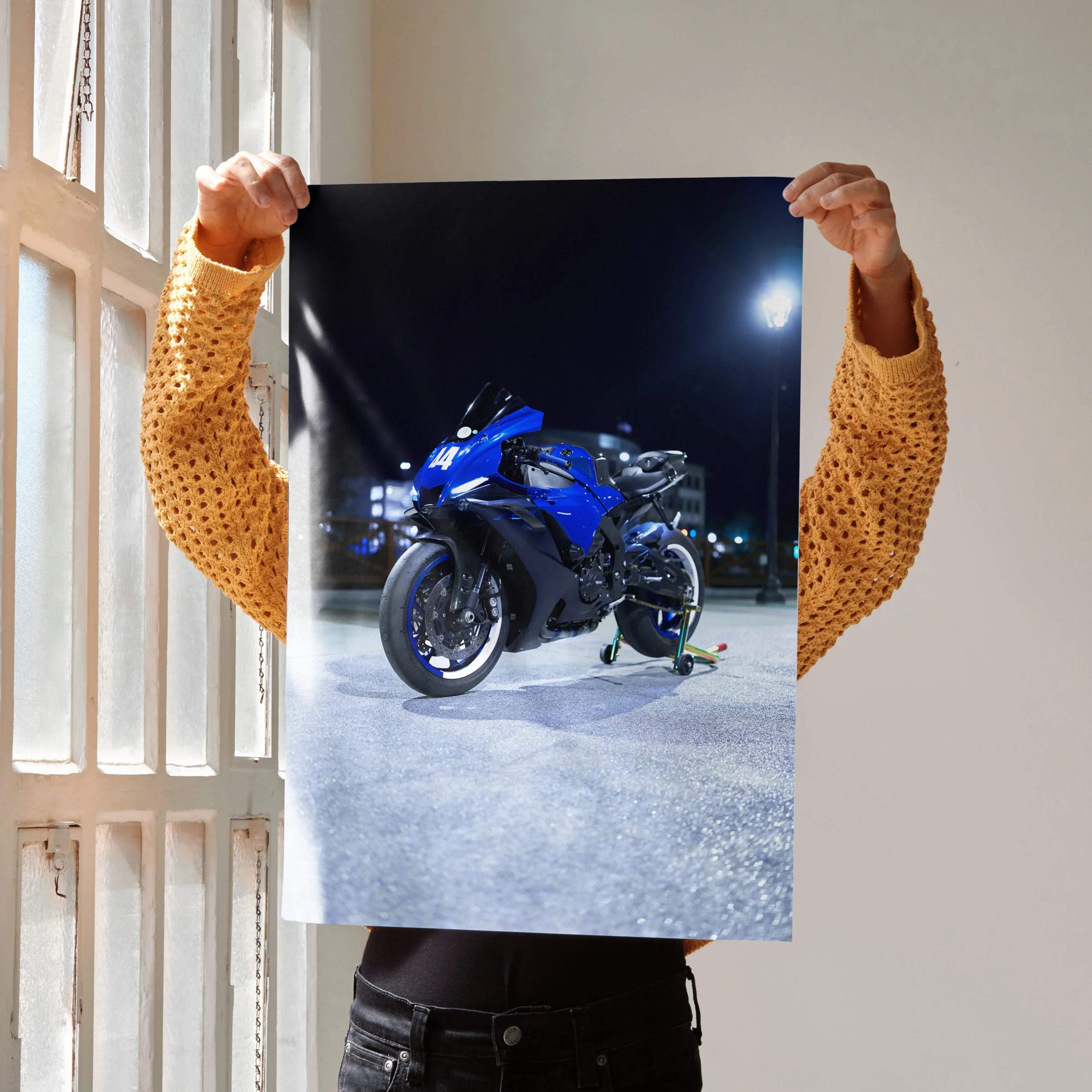 Vibrant blue and black Yamaha R1 motorcycle art print featuring sleek aerodynamic design and glowing headlights for wall decor