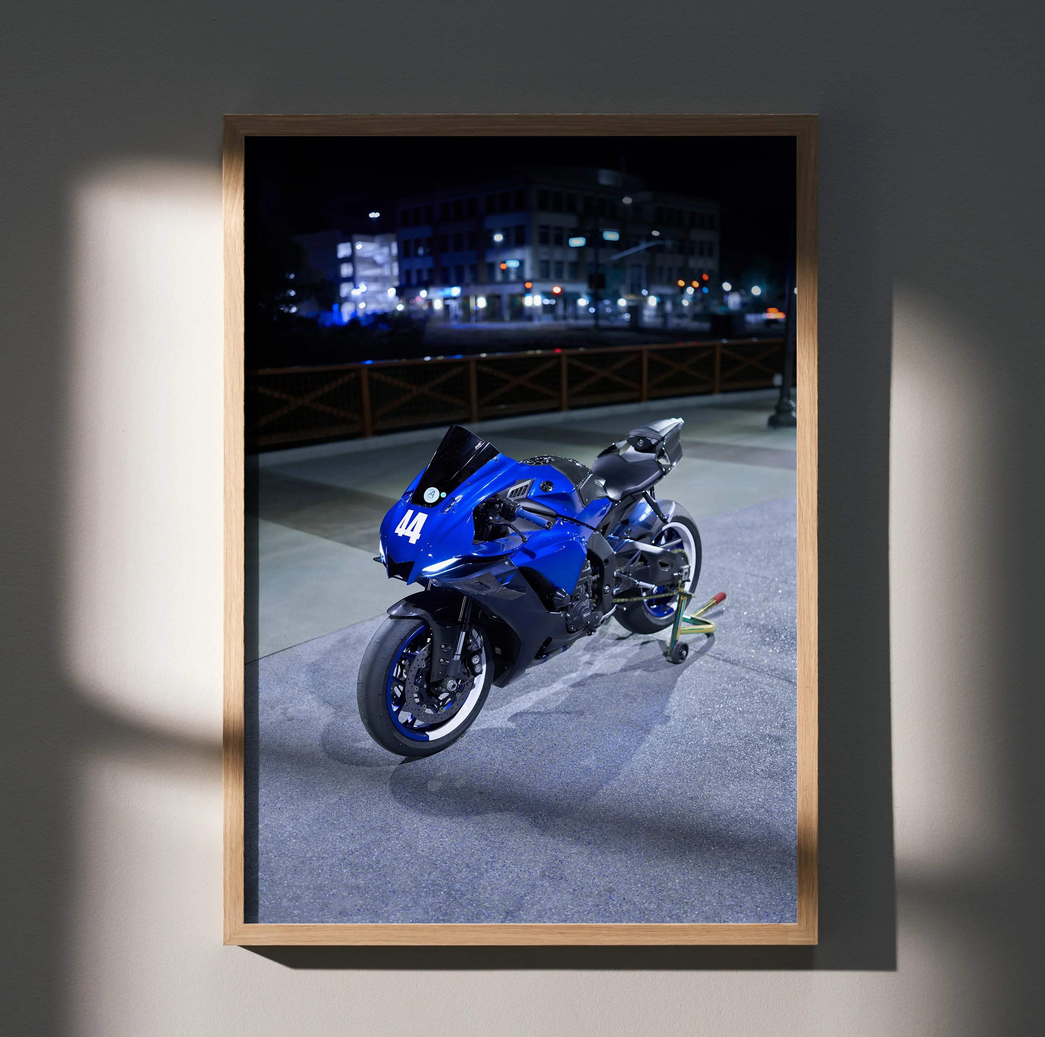 Framed photograph poster featuring a blue and black yamaha r6 motorcycle with number 44 celebrating motorcycle design
