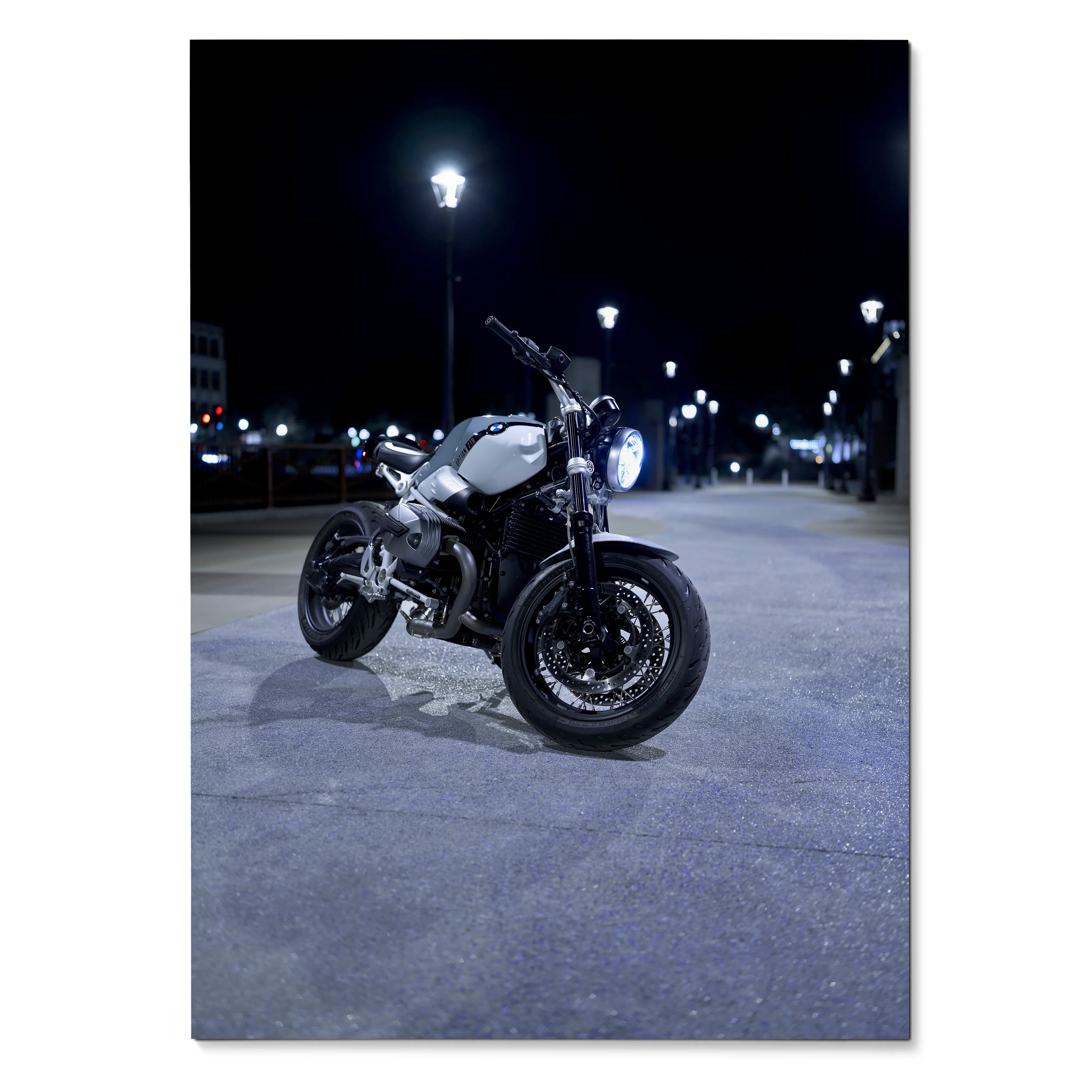 BMW R Nine T motorcycle parked at night under streetlights poster wall art.