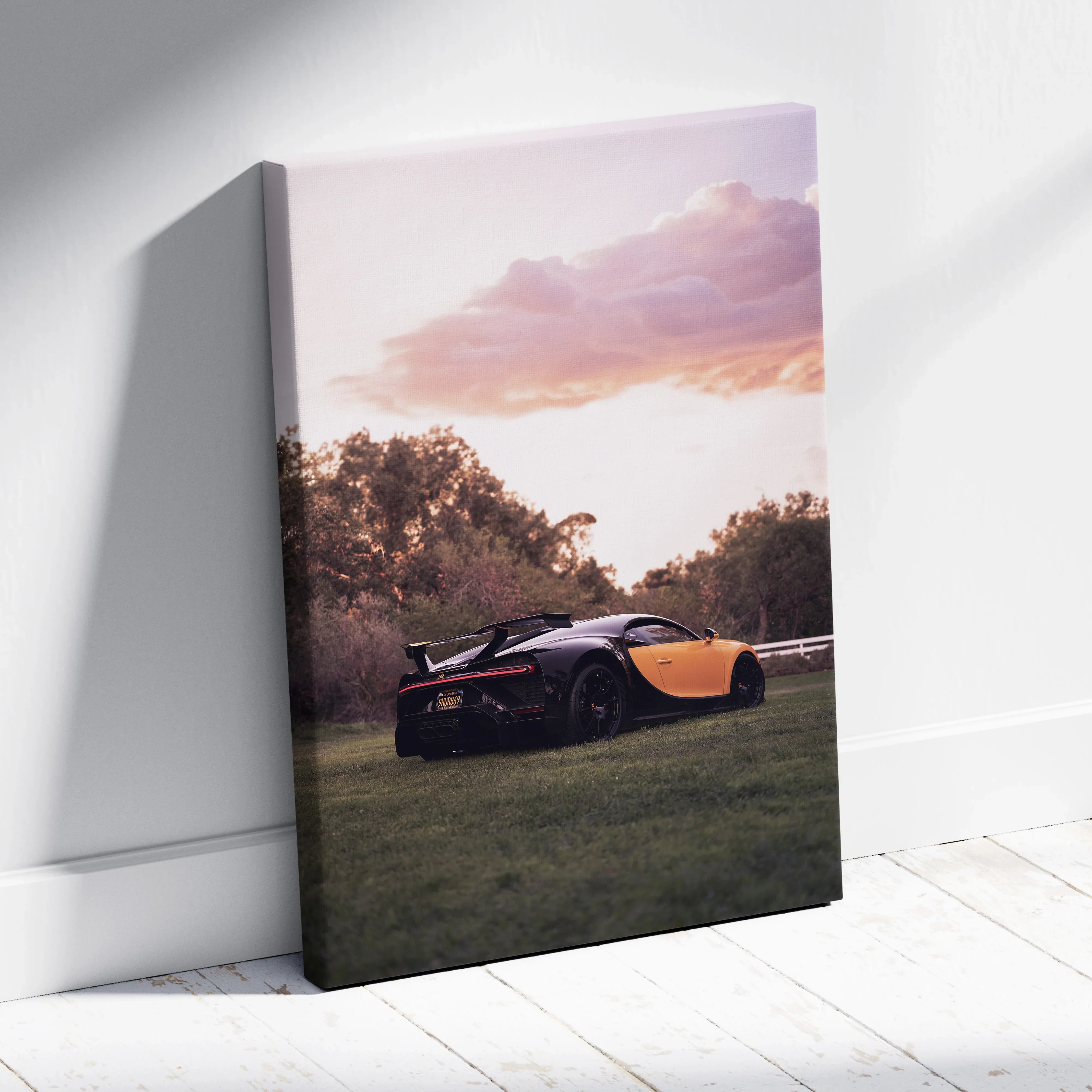 Vertical canvas wall art featuring a Bugatti Chiron at sunset with soft purple and orange sky.