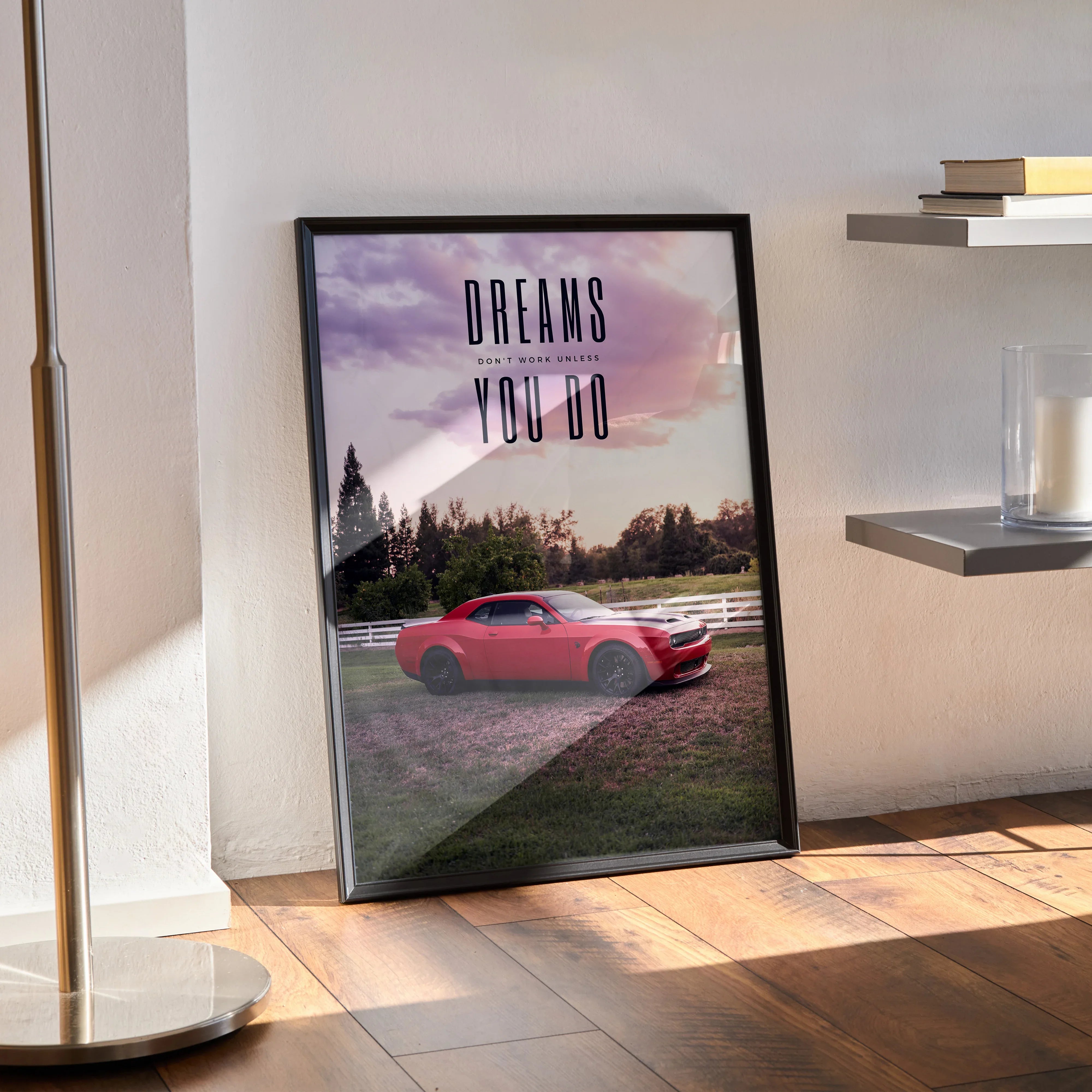 Motivational poster wall art featuring red Dodge Challenger Hellcat with inspiring text "Dreams You Do" in black frame.