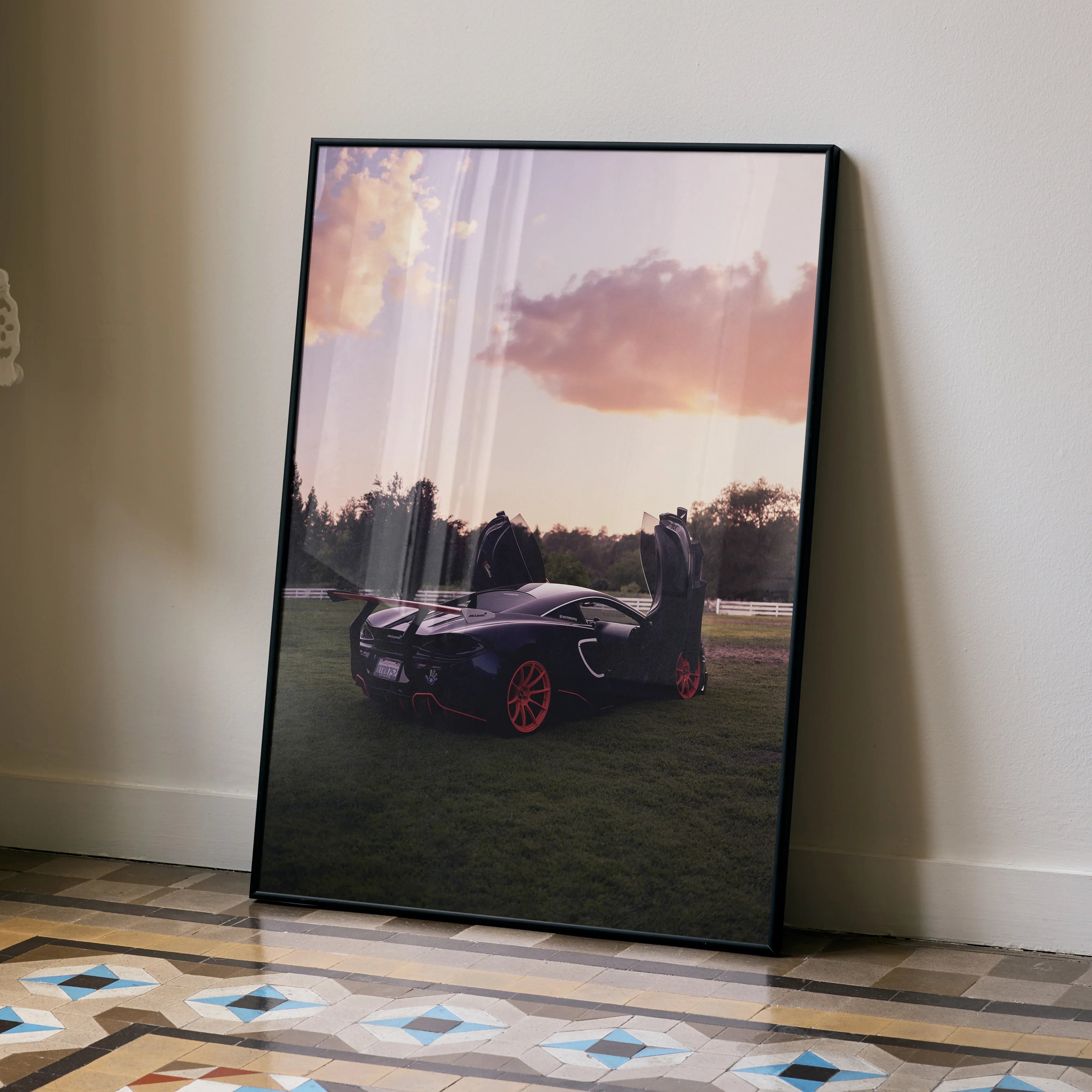 McLaren 570s supercar poster with sunset backdrop and red wheels wall art.