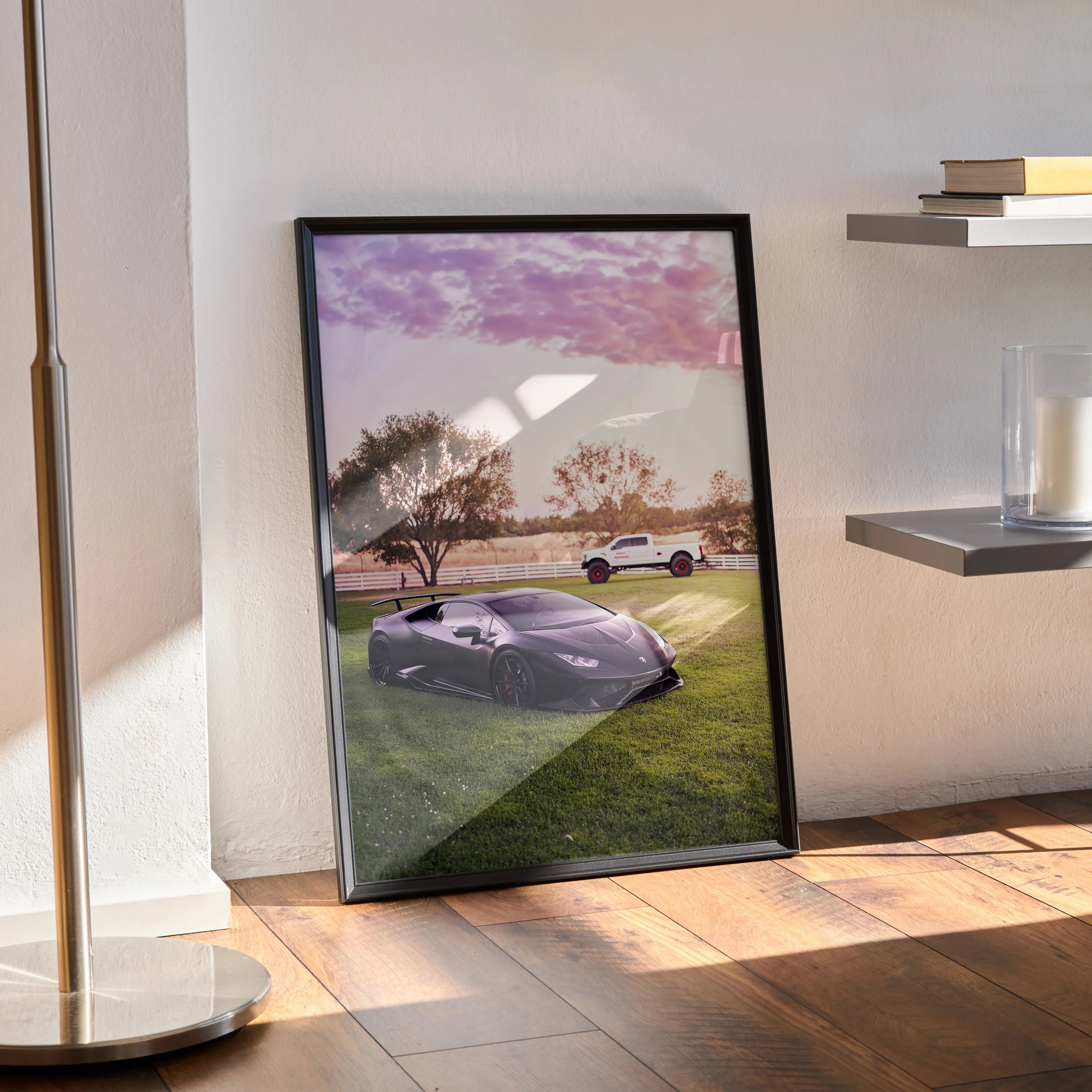 Lamborghini Huracan poster wall art with sunset sky and grassy field in black frame.