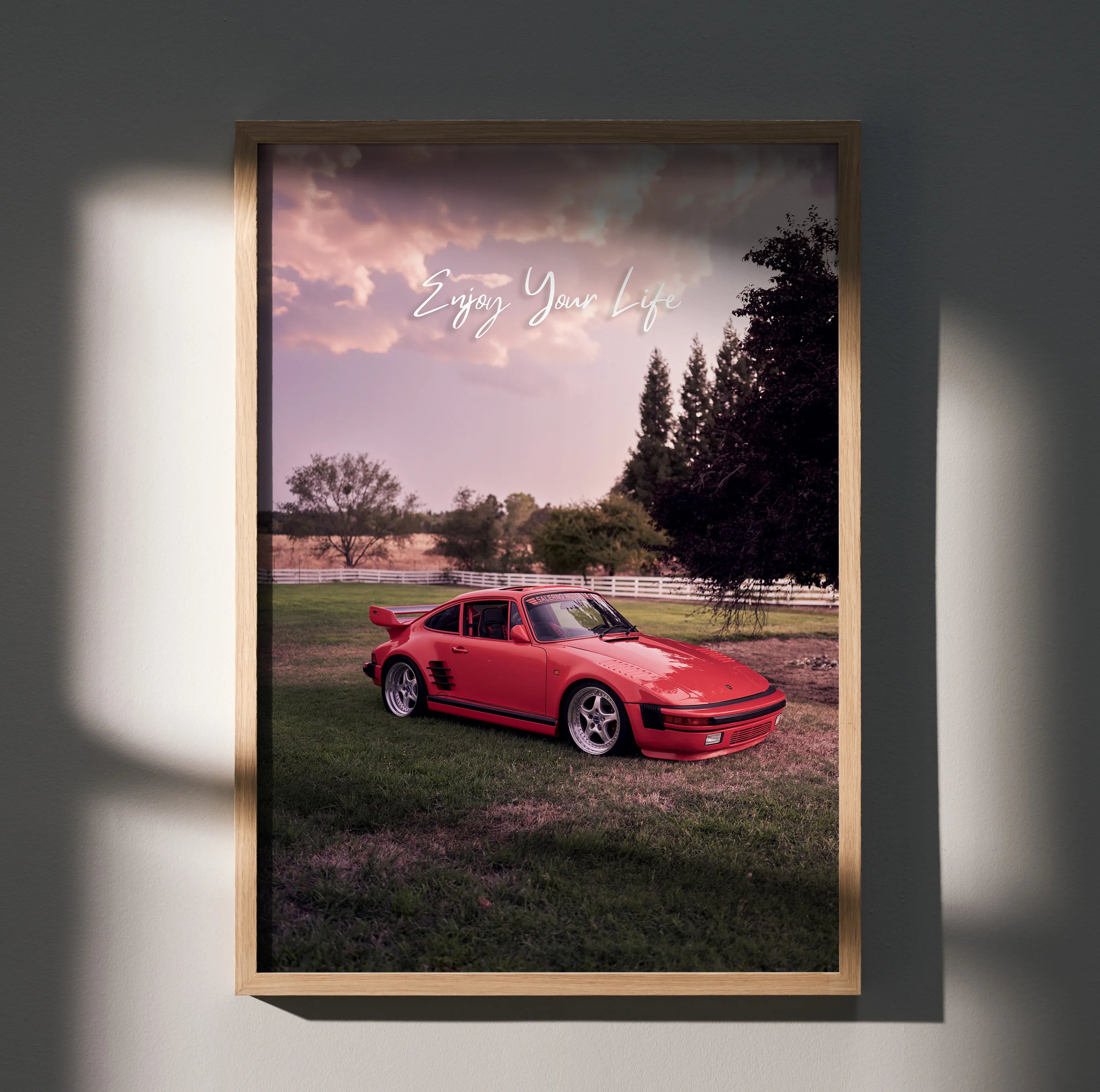 Motivational poster wall art featuring red Porsche 911 Turbo Slant-Nose with scenic sunset background.
