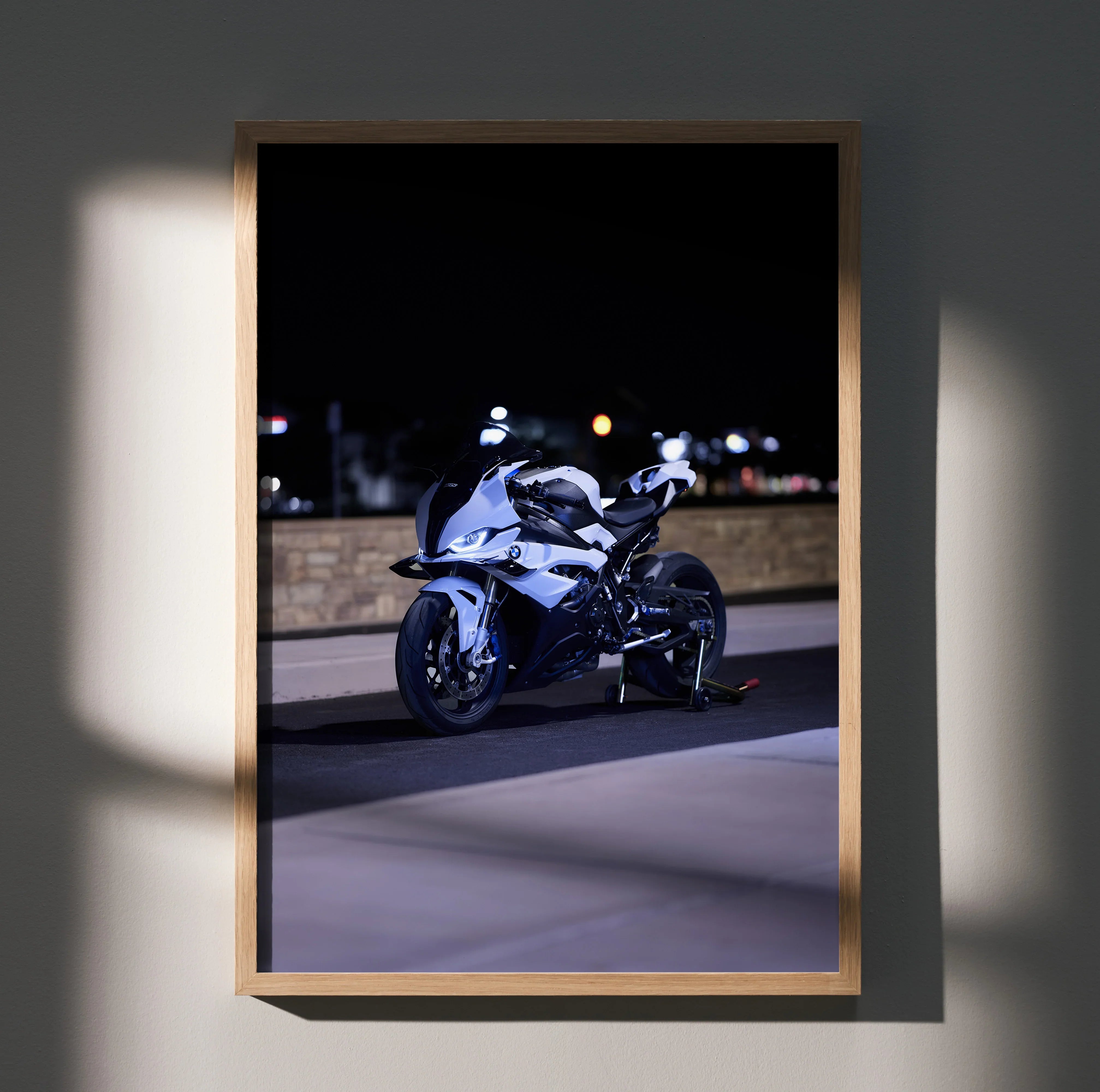 BMW S1000RR motorcycle poster with dynamic night city backdrop, modern wall art in wooden frame.
