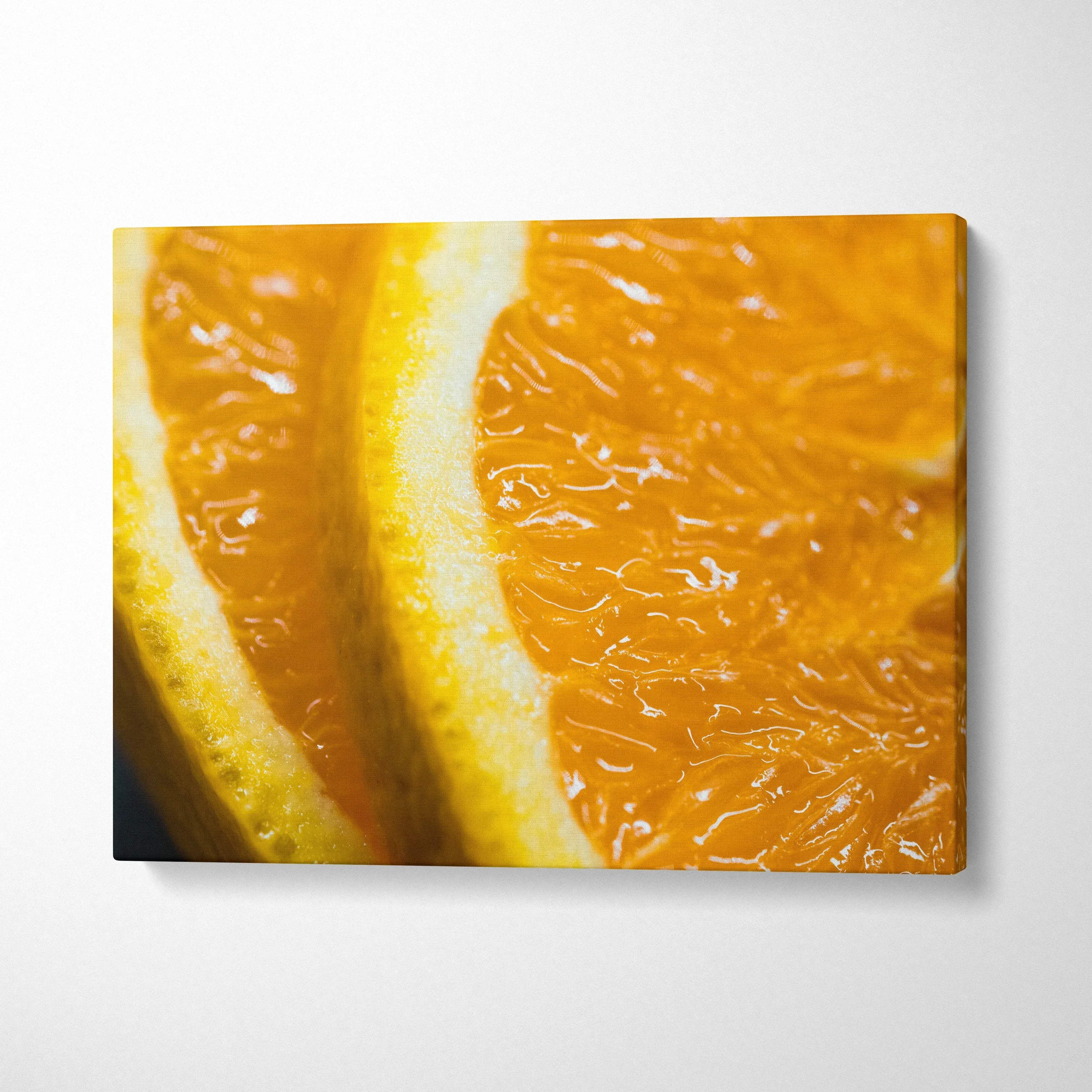 Vibrant orange slices close-up on bright canvas wall art for home decor.