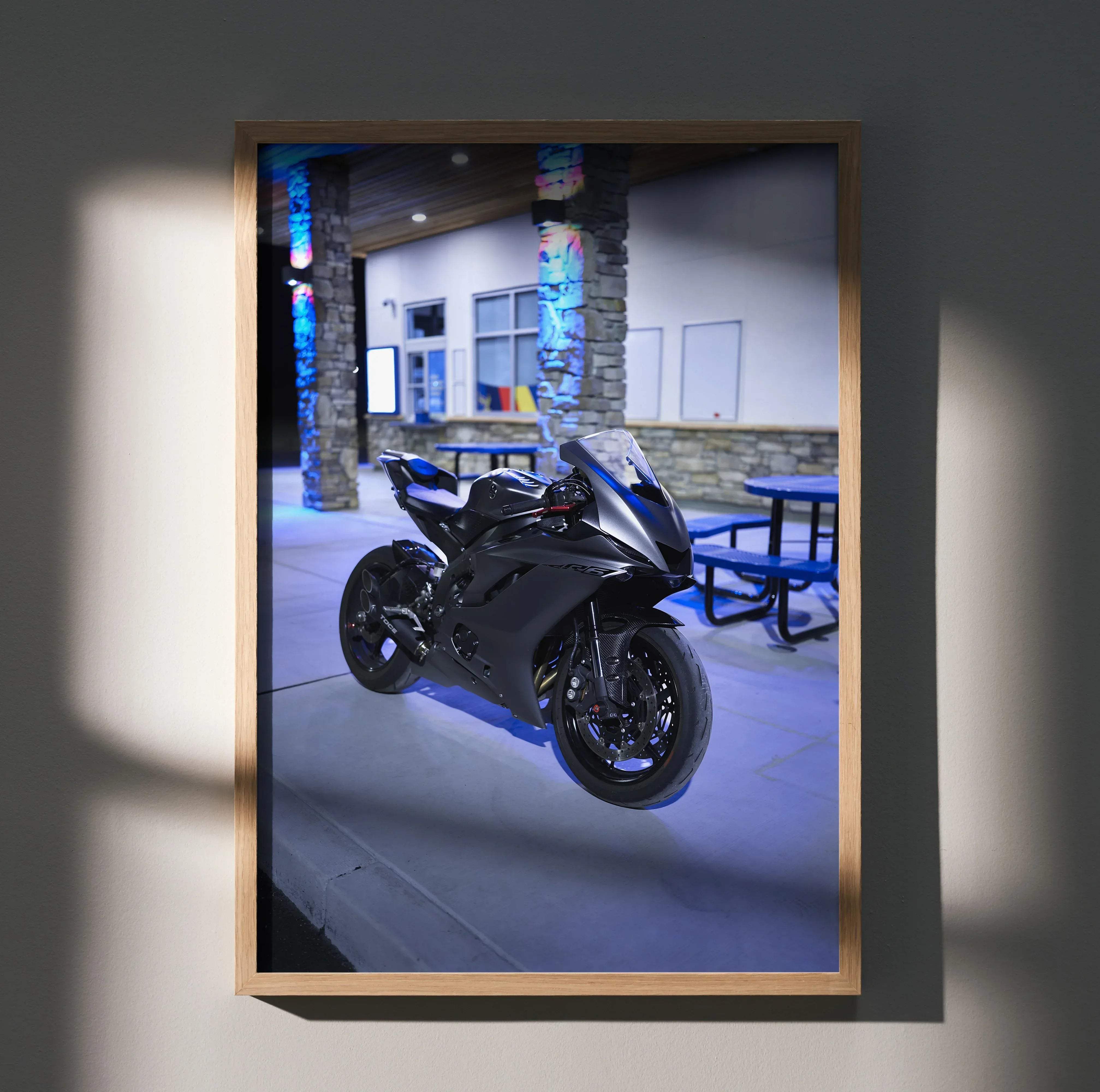 Black and blue Yamaha R6 sport motorcycle art print in a light wood frame showcasing iconic speed and aesthetic appeal