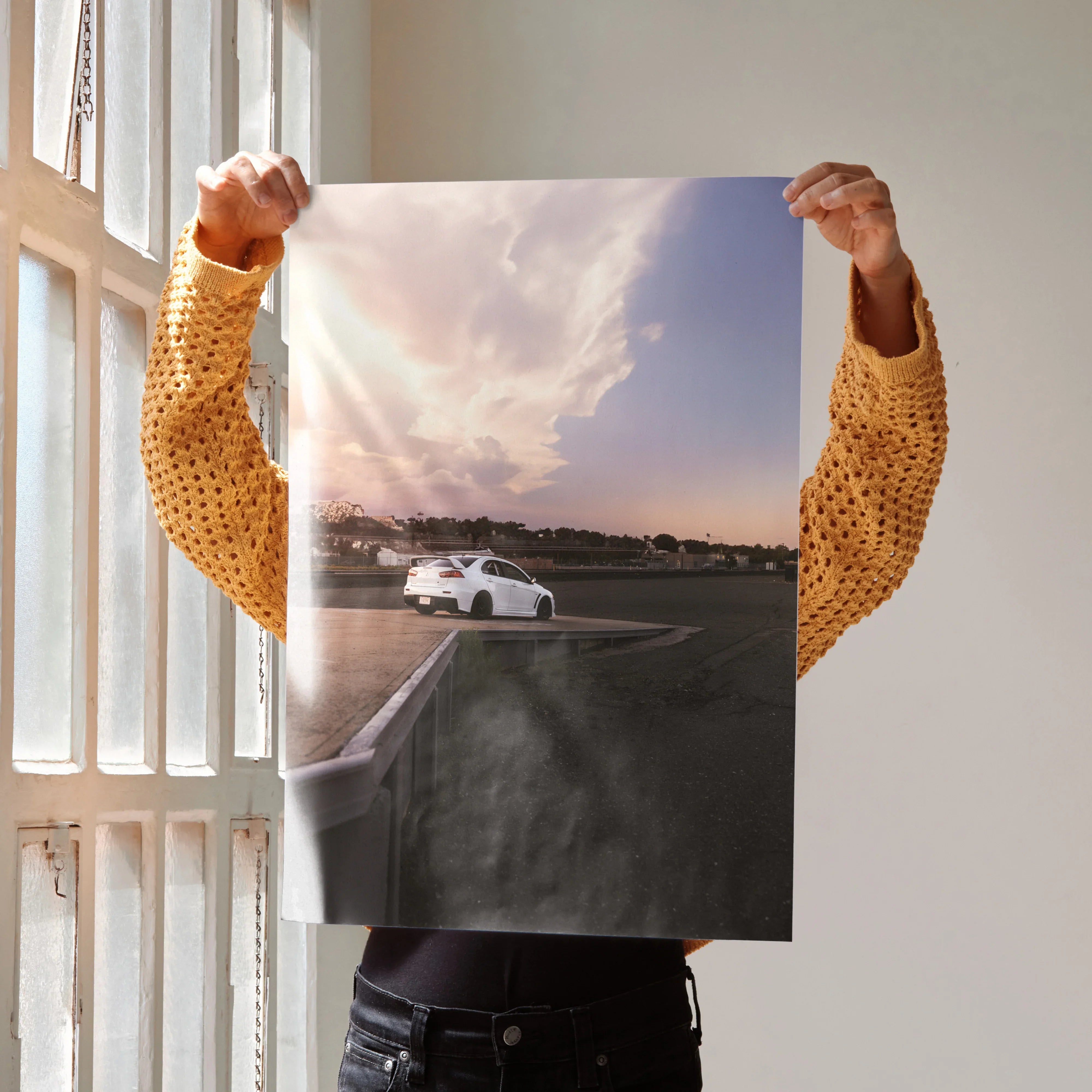 Mitsubishi Evo 10 poster showing white car on road at sunset, premium wall art for enthusiasts.