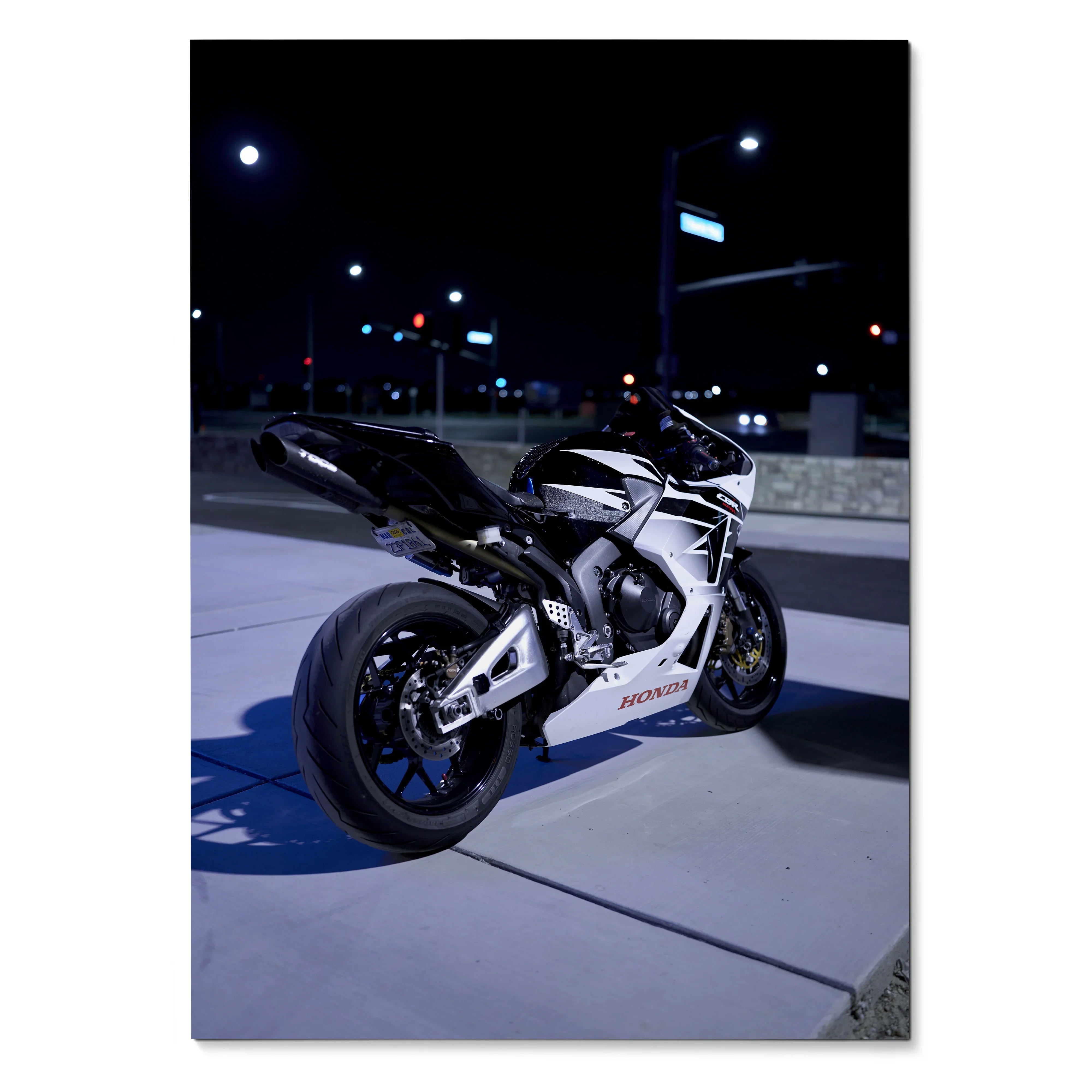 Honda CBR600RR motorcycle parked on urban sidewalk at night poster wall art.