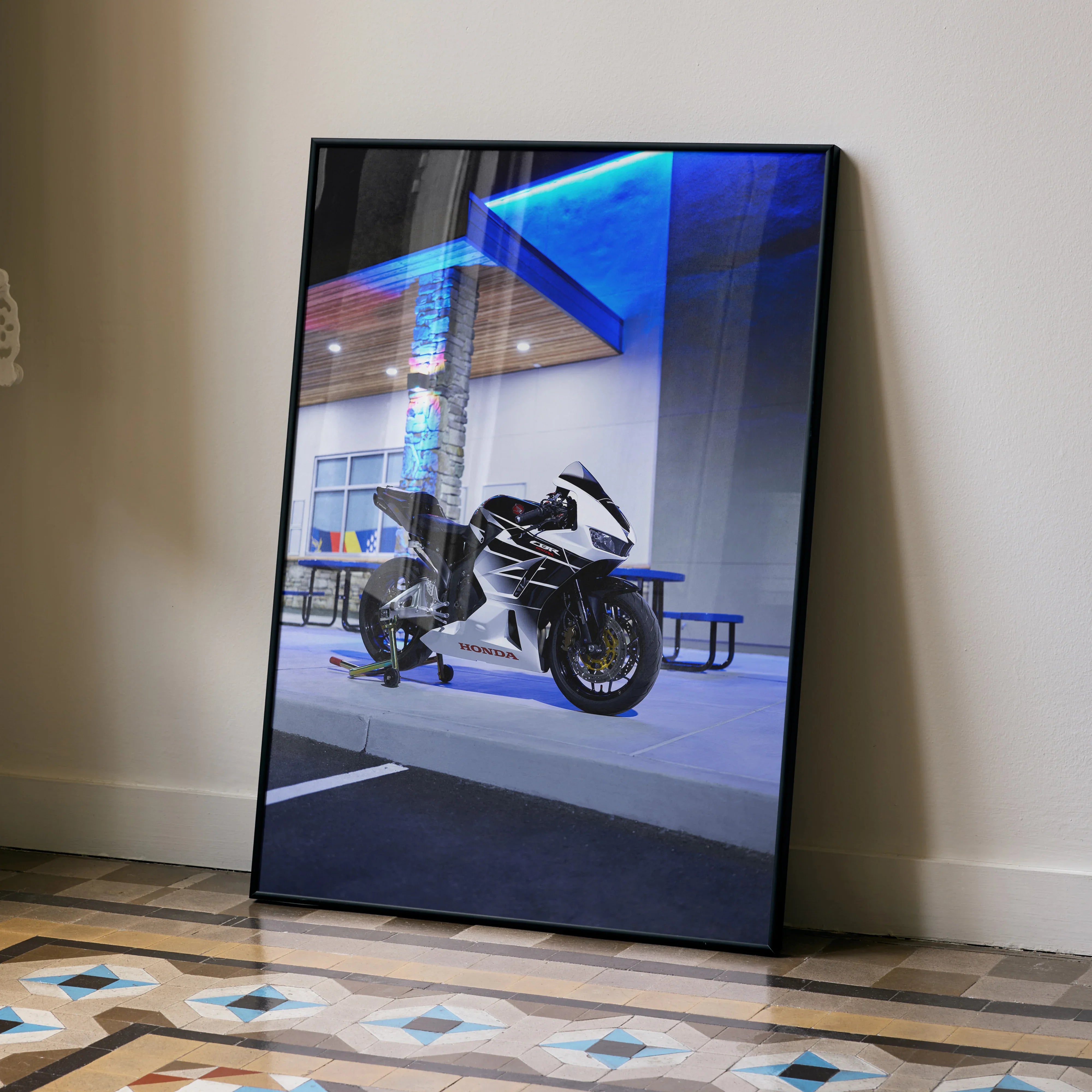 Honda CBR600RR motorcycle poster with sleek black and white design leaning against wall, vibrant wall art.