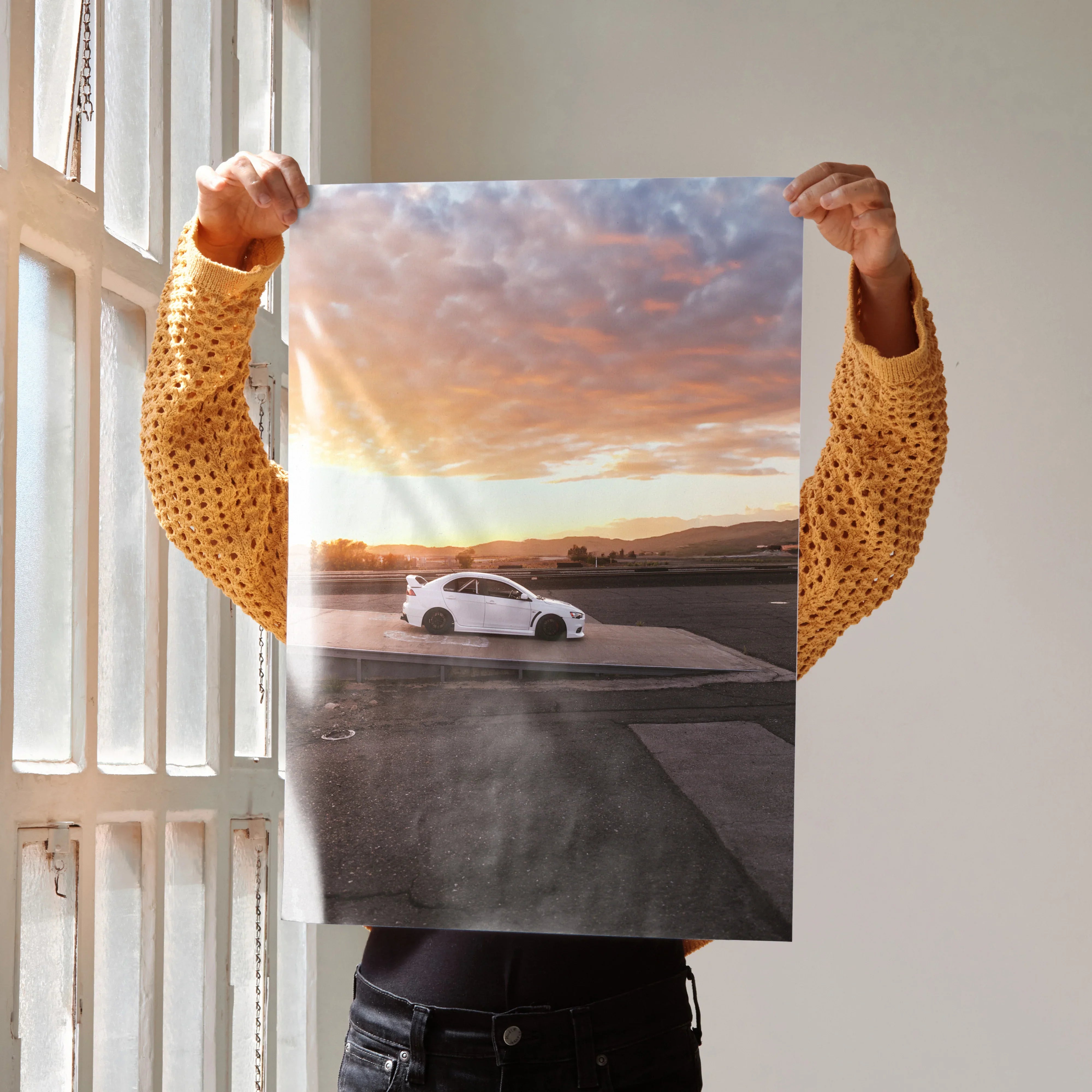 Mitsubishi Evo 10 poster wall art with white car on racetrack under dramatic sunset sky.
