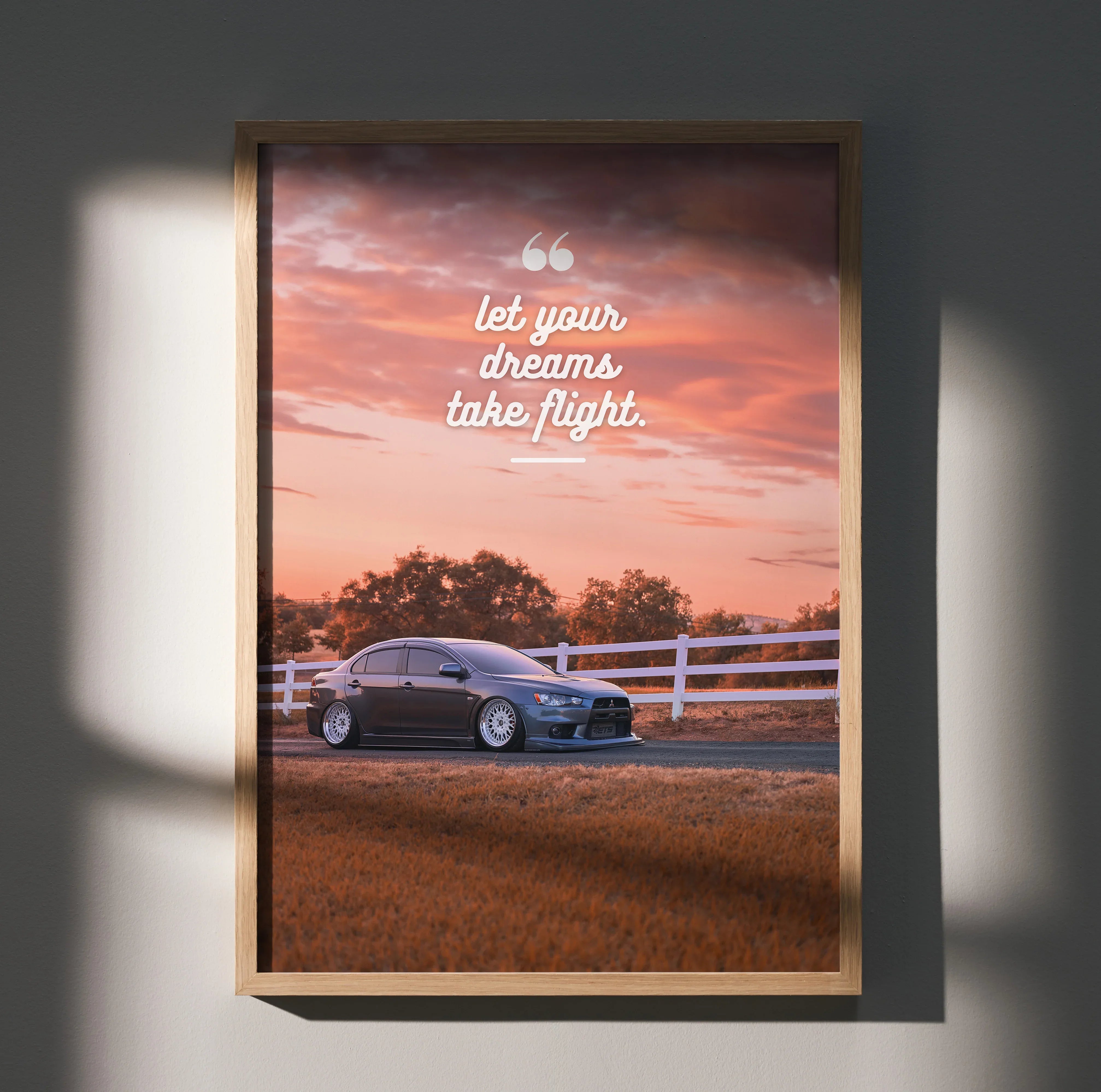 Motivational poster wall art with Mitsubishi Evo 10 at sunset and inspiring text "Let your dreams take flight".
