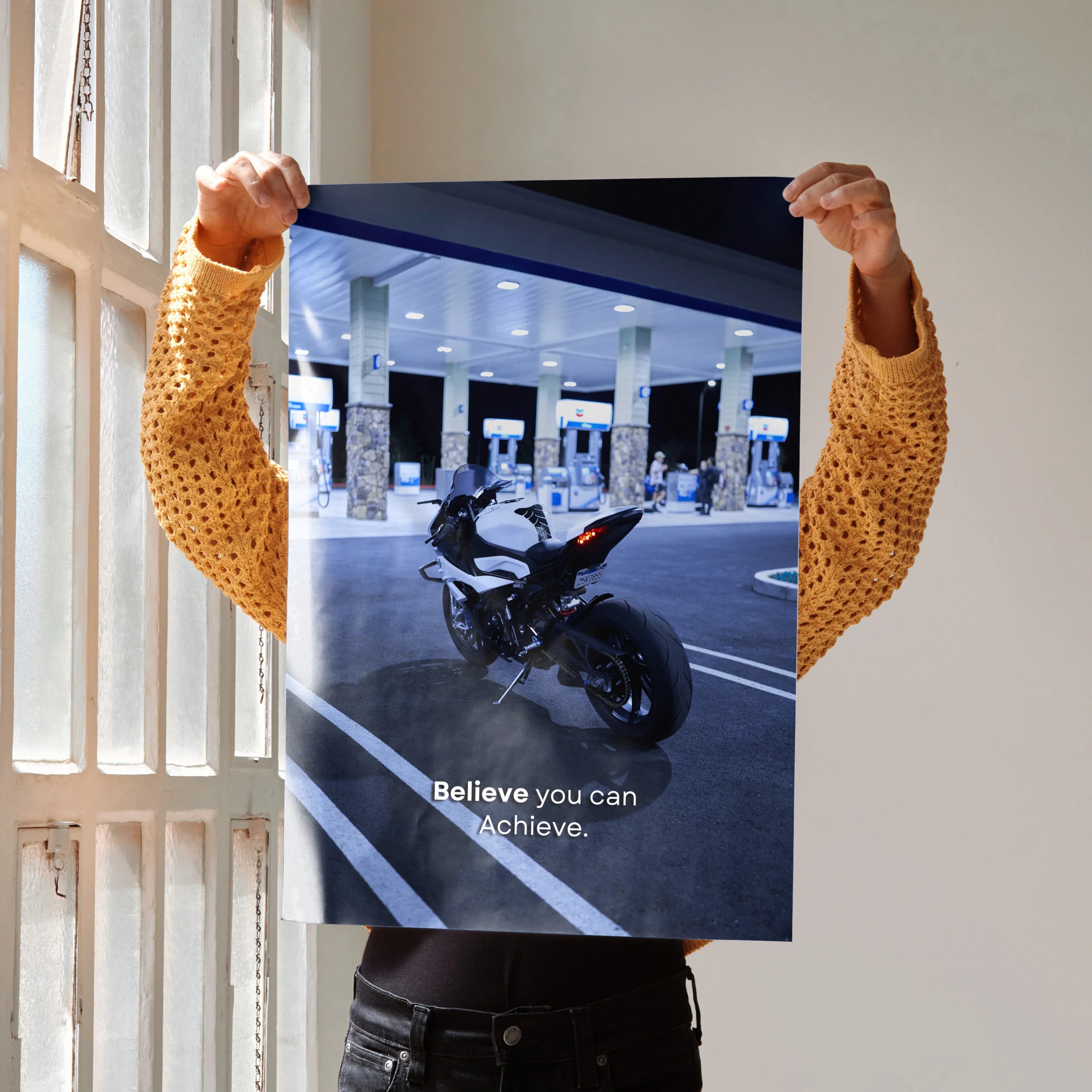 BMW S1000RR motorcycle poster with motivational text "Believe you can and you're halfway there" as wall art.