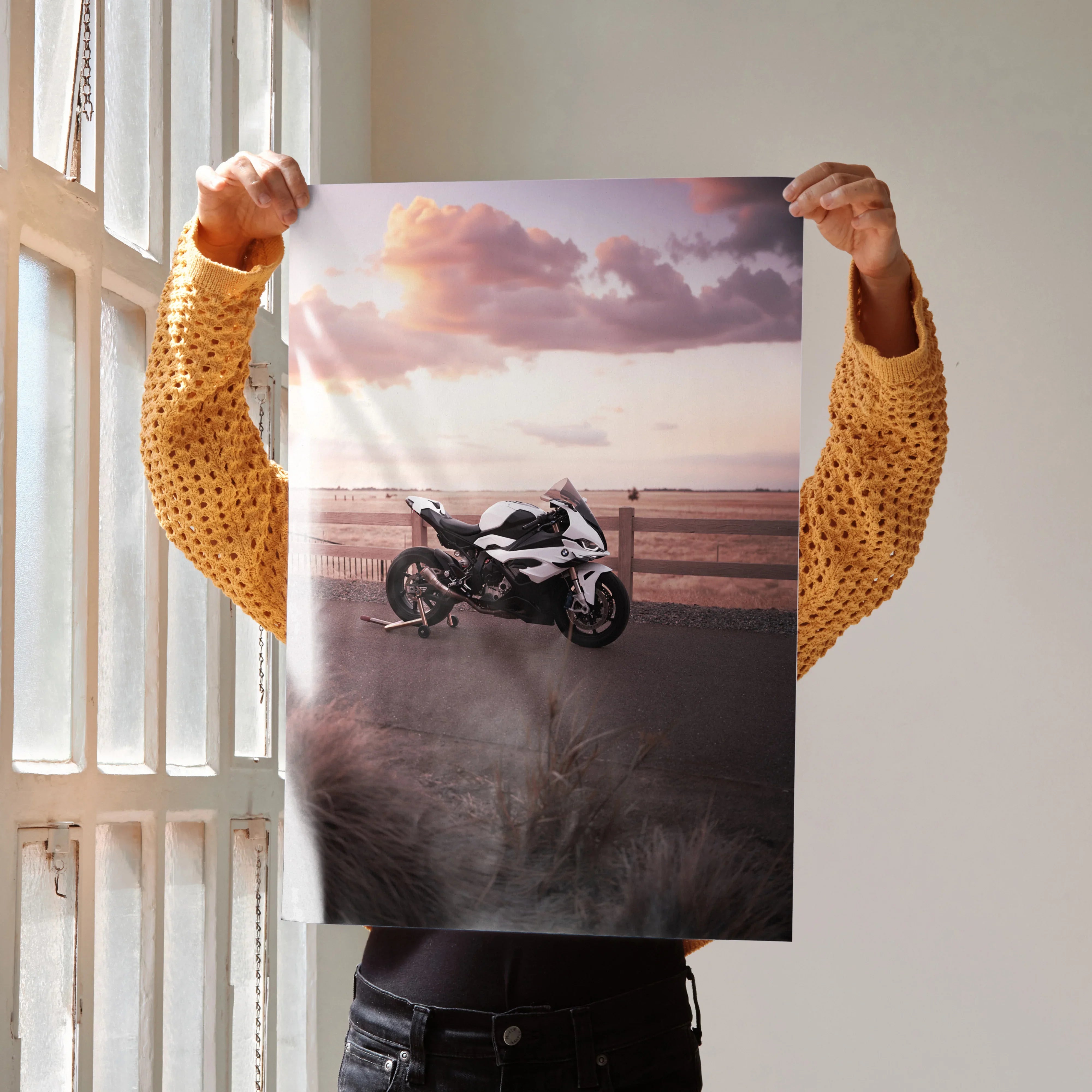 BMW S1000RR motorcycle wall art poster featuring a sleek bike on a scenic coastal road at sunset.