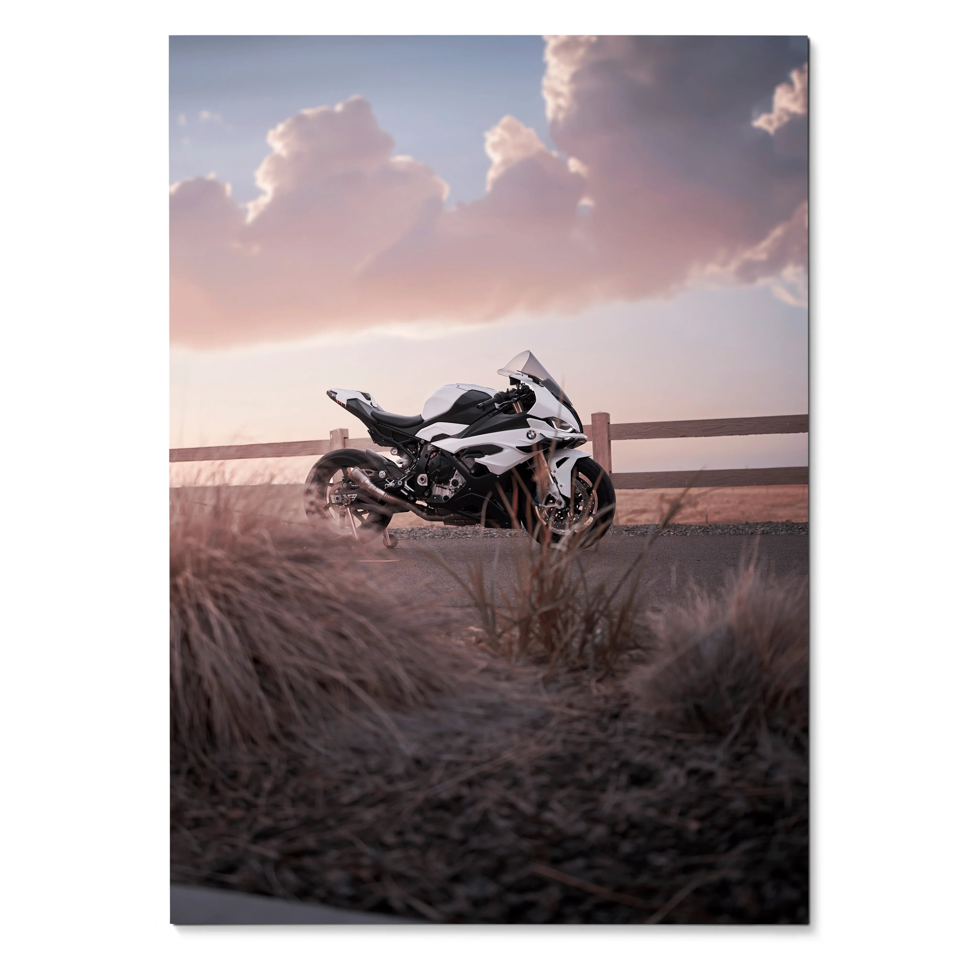 BMW S1000RR motorcycle parked on rural road at sunset poster wall art with dramatic sky.