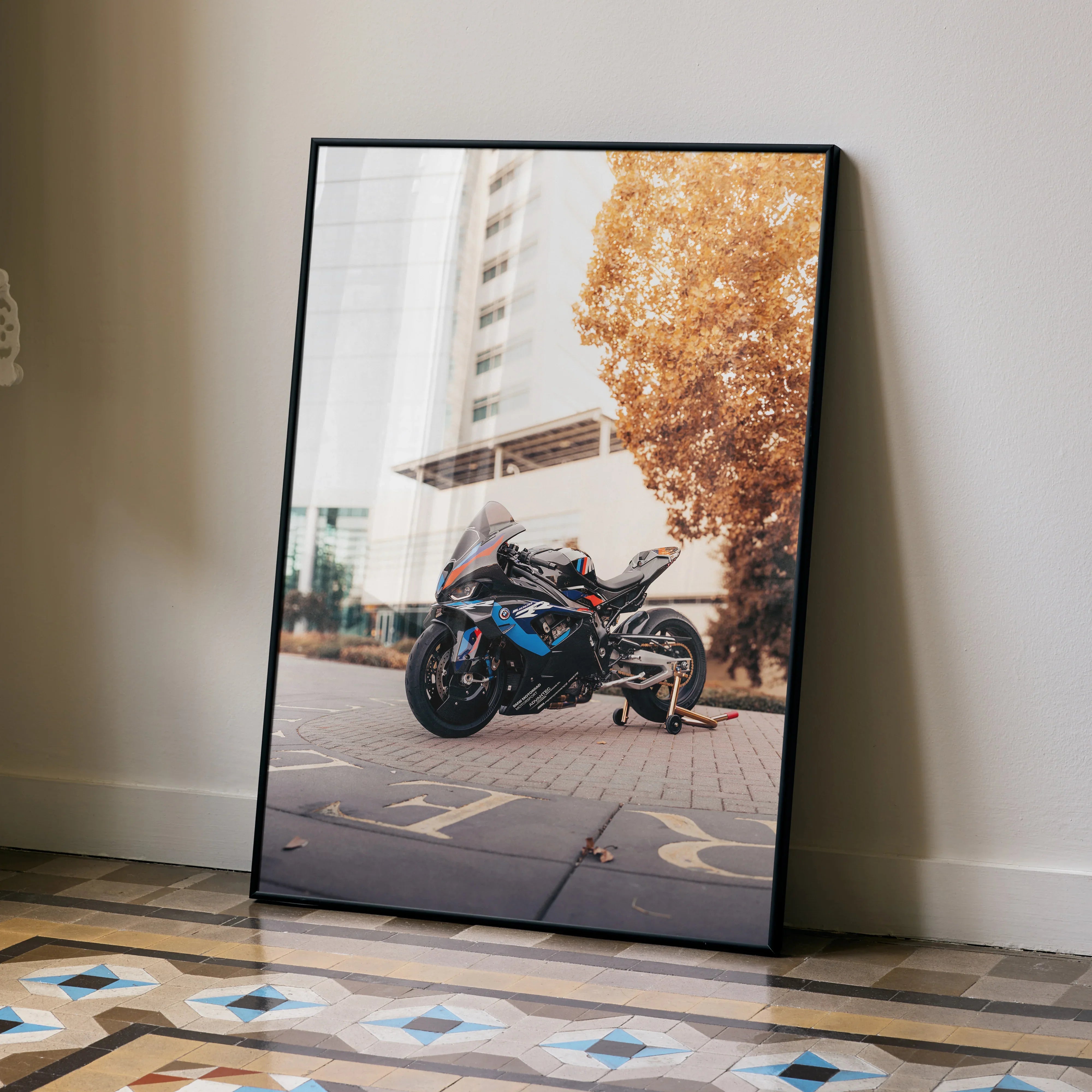 BMW M1000RR motorcycle poster with city background and autumn tree wall art.