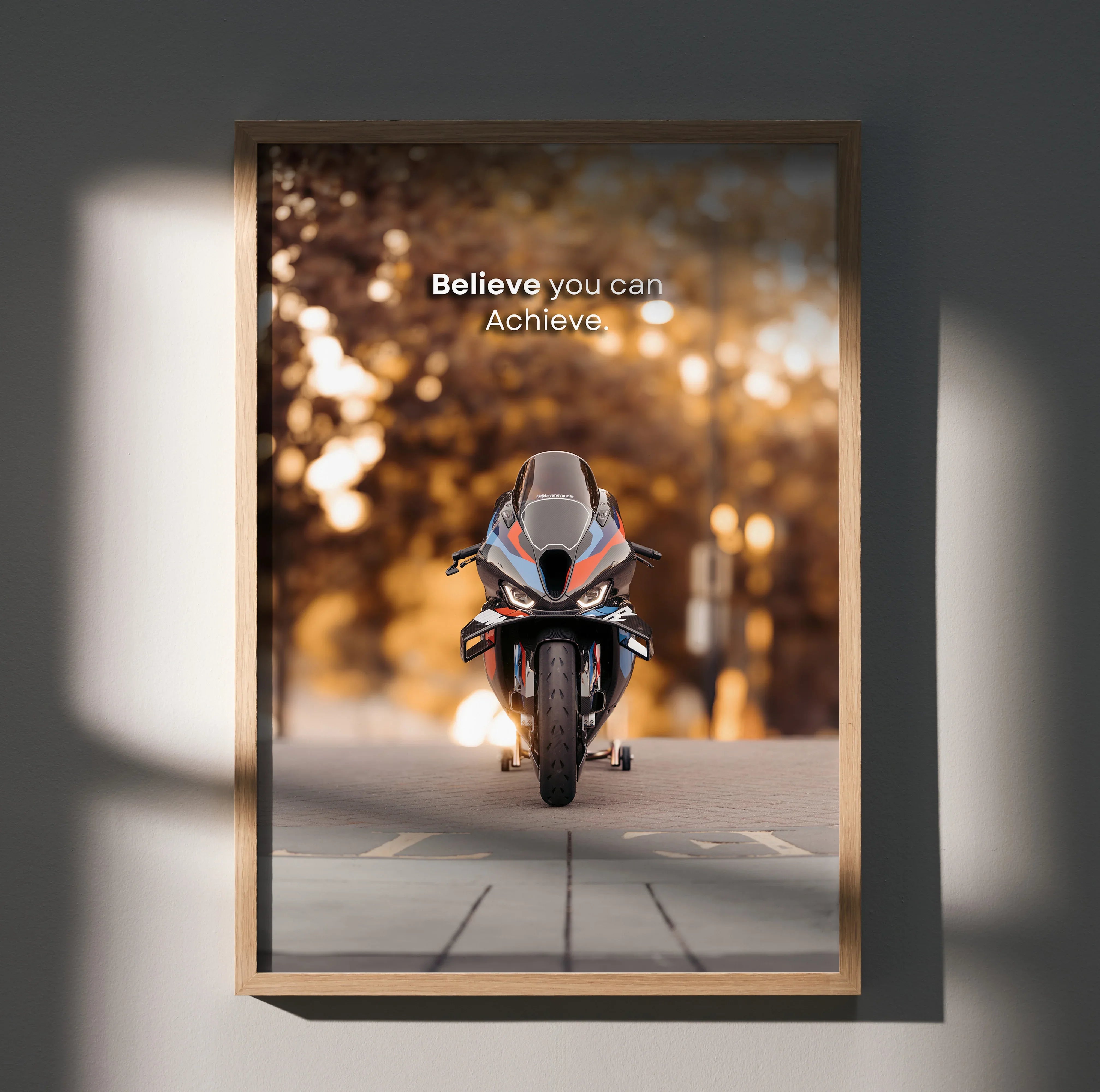 Motivational poster wall art featuring a BMW M1000RR motorcycle with inspiring text "Believe you can. Achieve.
