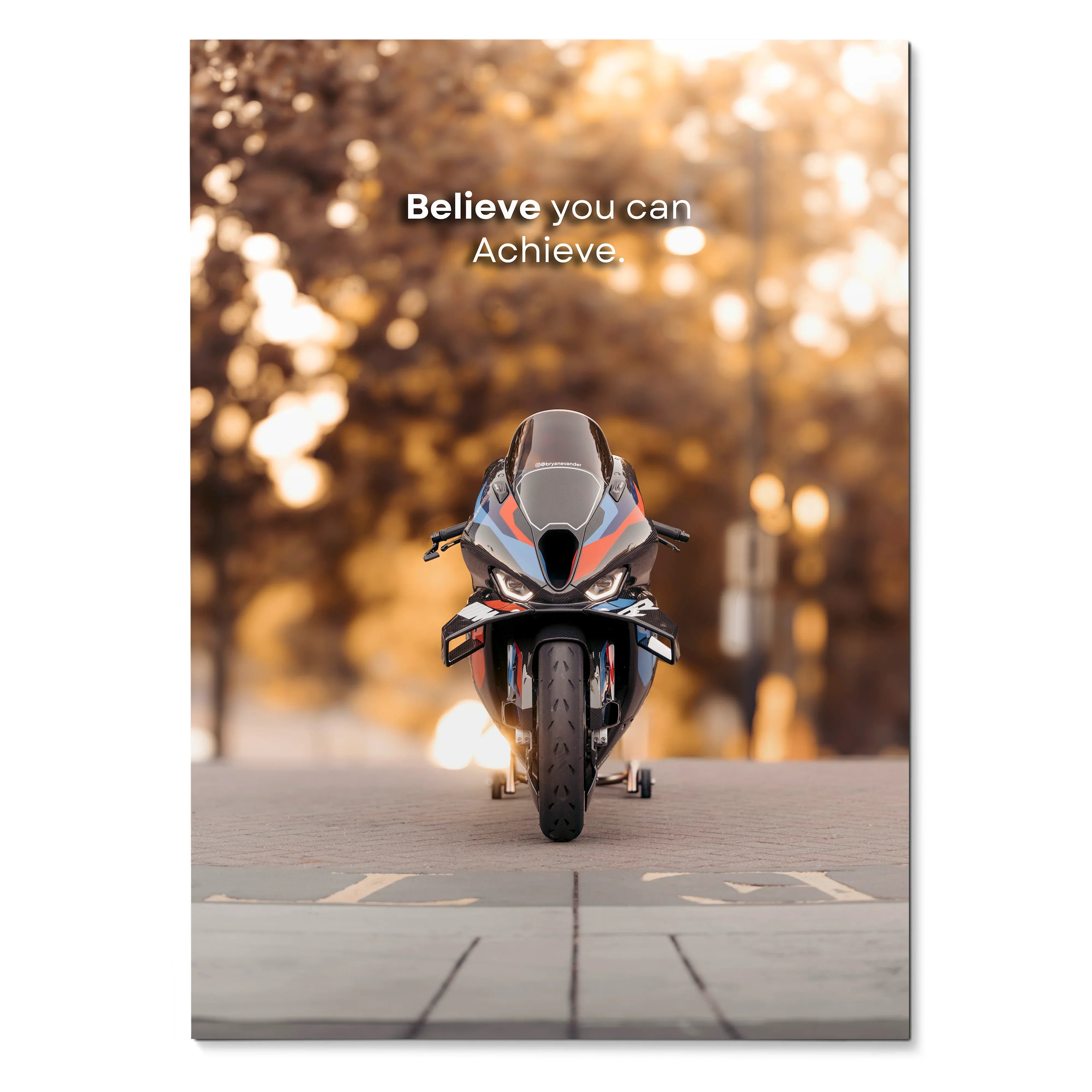 Motivational poster featuring BMW M1000RR motorcycle front view with inspiring text and blurred autumn background wall art.