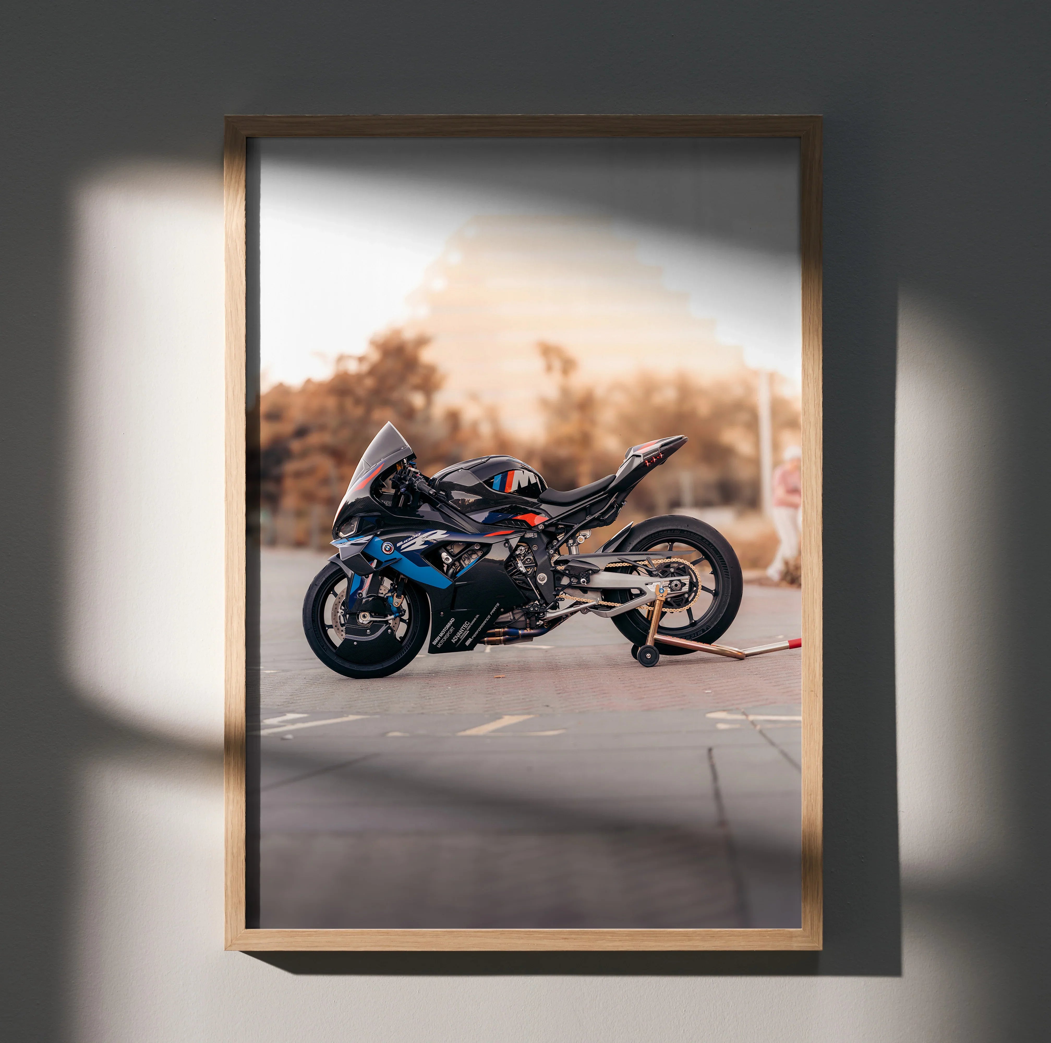 BMW M1000RR motorcycle poster wall art with sleek black and blue sportbike design in wooden frame.