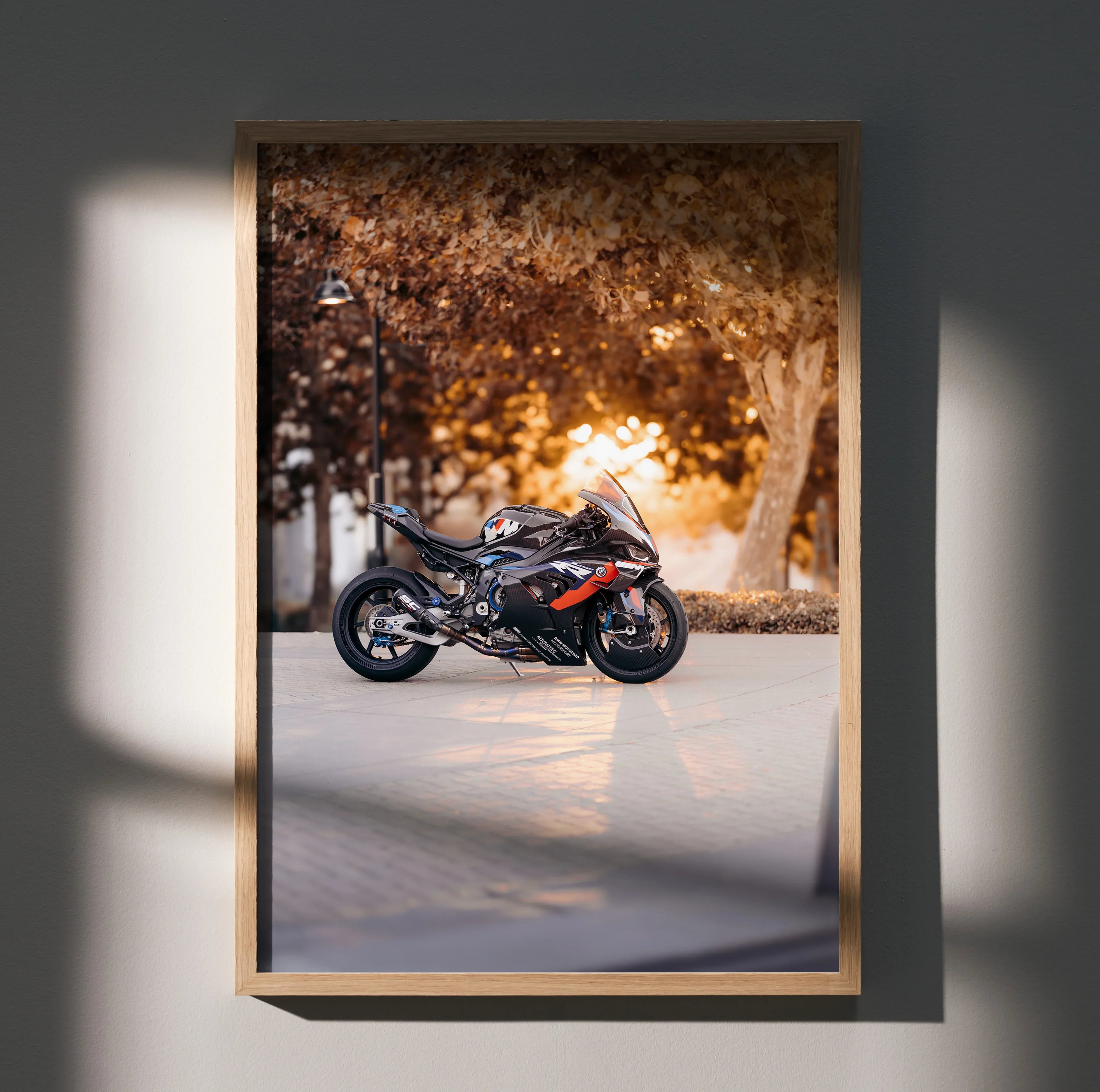 BMW M1000RR motorcycle poster with sunset background and autumn trees wall art.