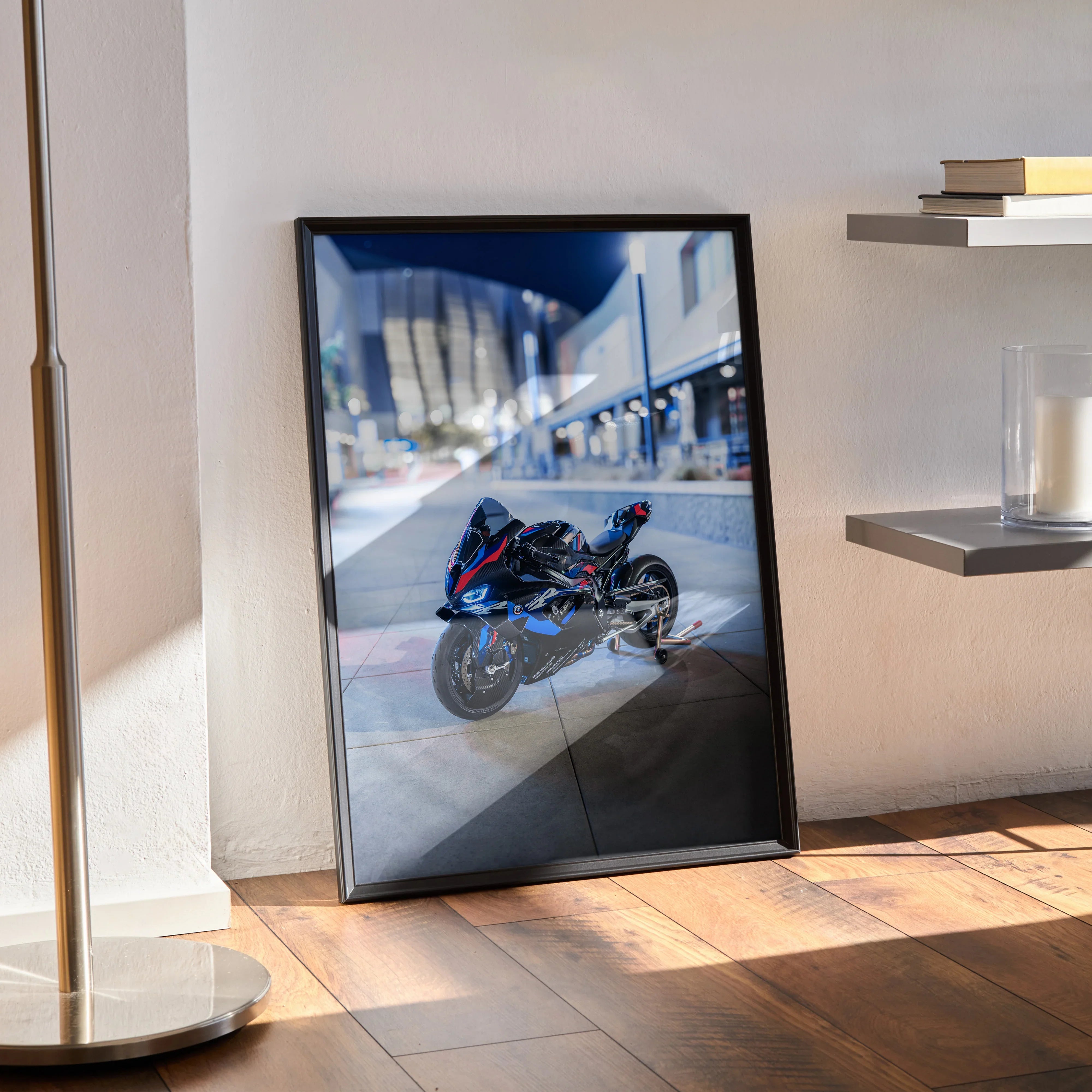BMW M1000RR motorcycle poster wall art with dynamic urban background in black frame.