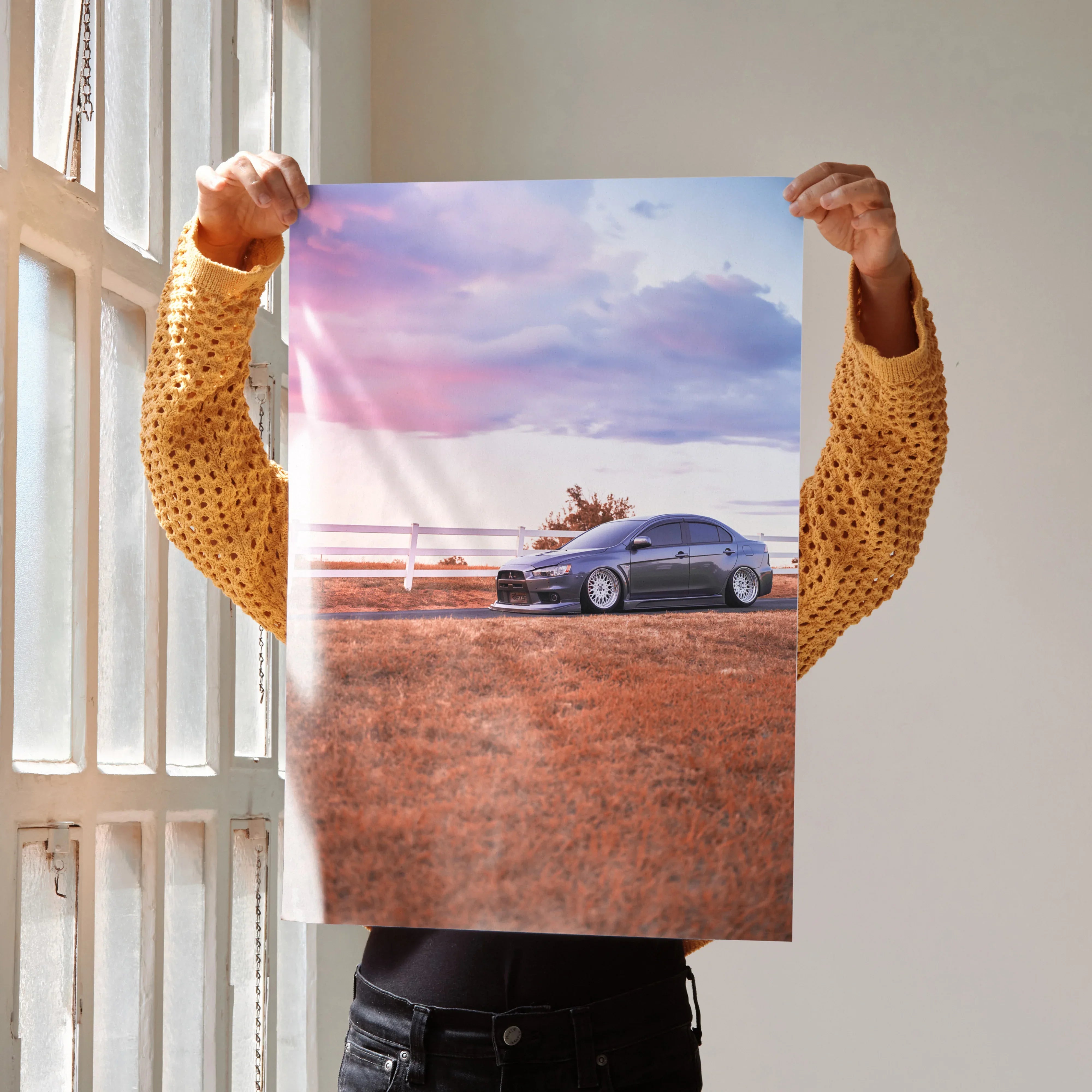 Mitsubishi Evo 10 car on dirt road under pink and purple sunset sky poster wall art.